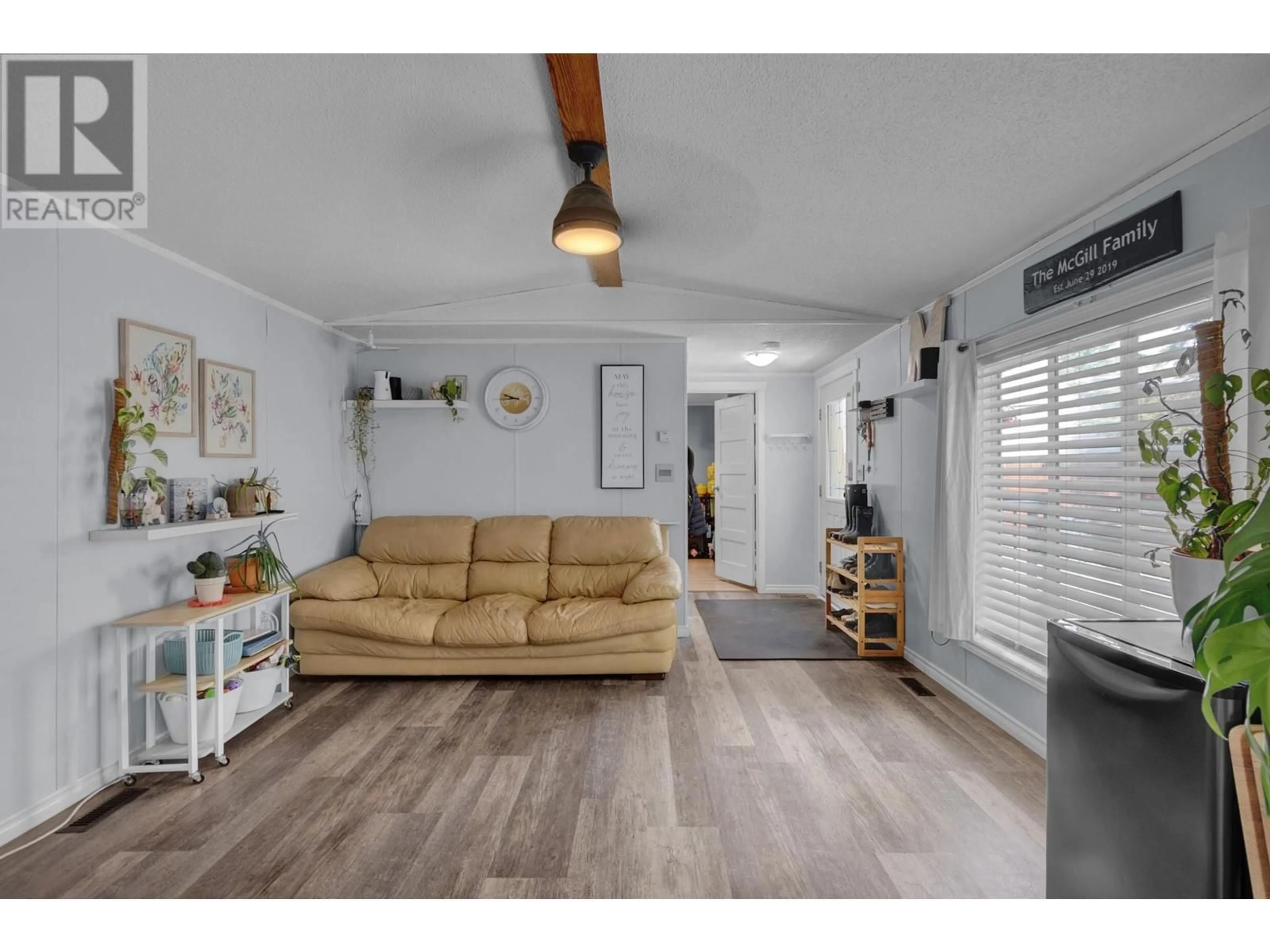 Living room with furniture, wood/laminate floor for 3037 THEE COURT, Prince George British Columbia V2K5B5