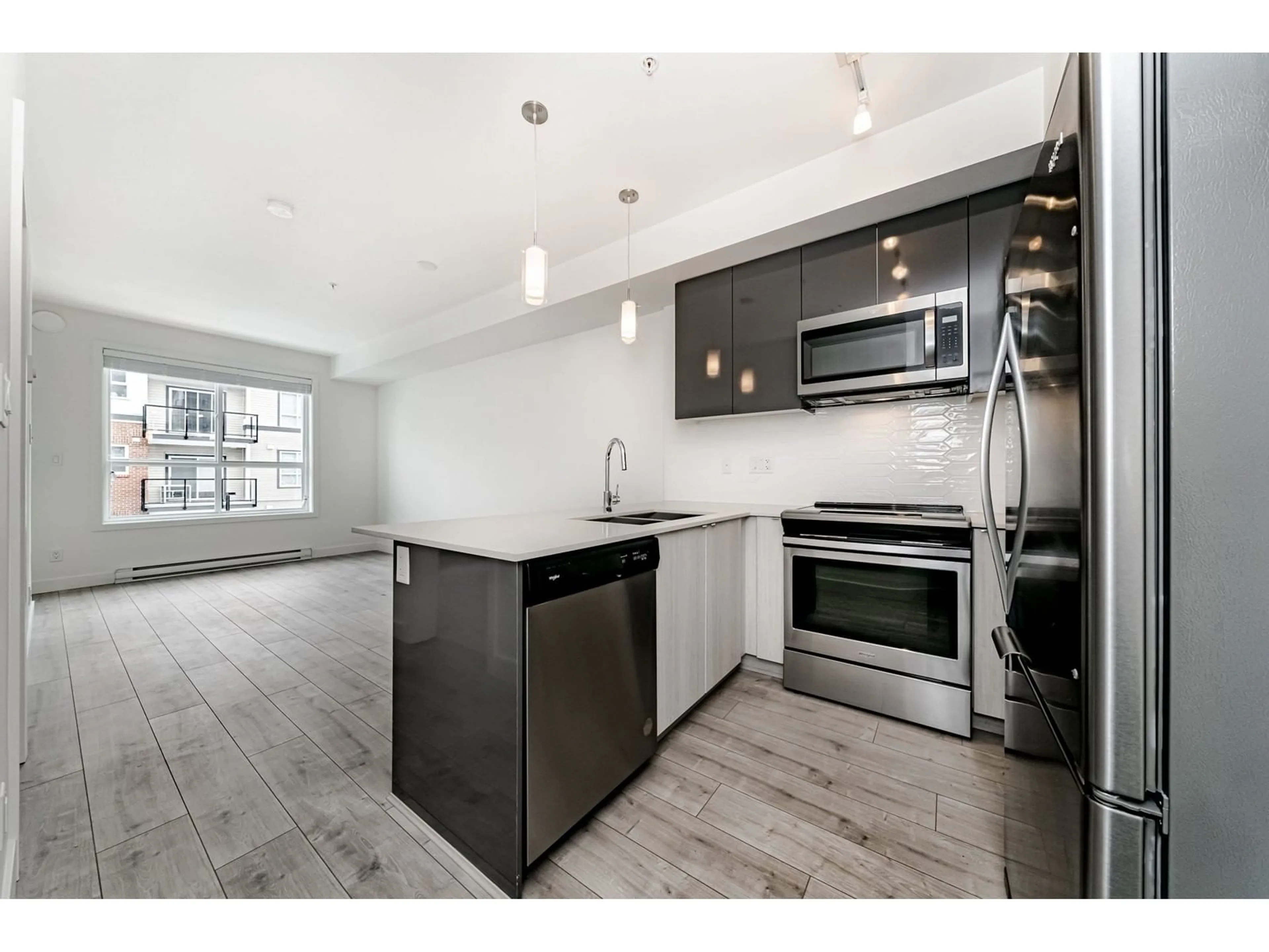 Open concept kitchen, unknown for 214 - 19567 64, Surrey British Columbia V3S7H8