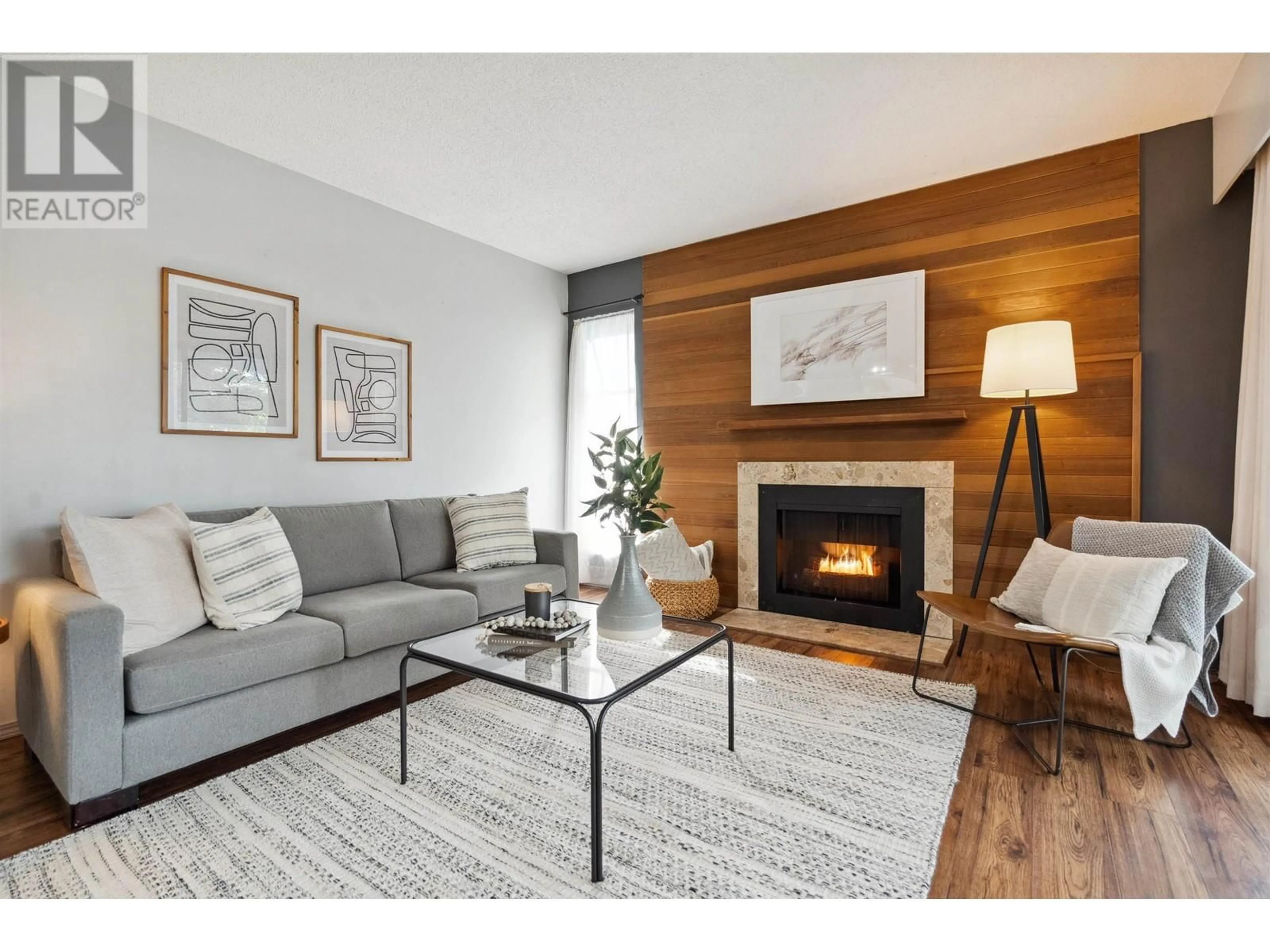 Living room with furniture, wood/laminate floor for 401 - 1717 HARO STREET, Vancouver British Columbia V6G1H1
