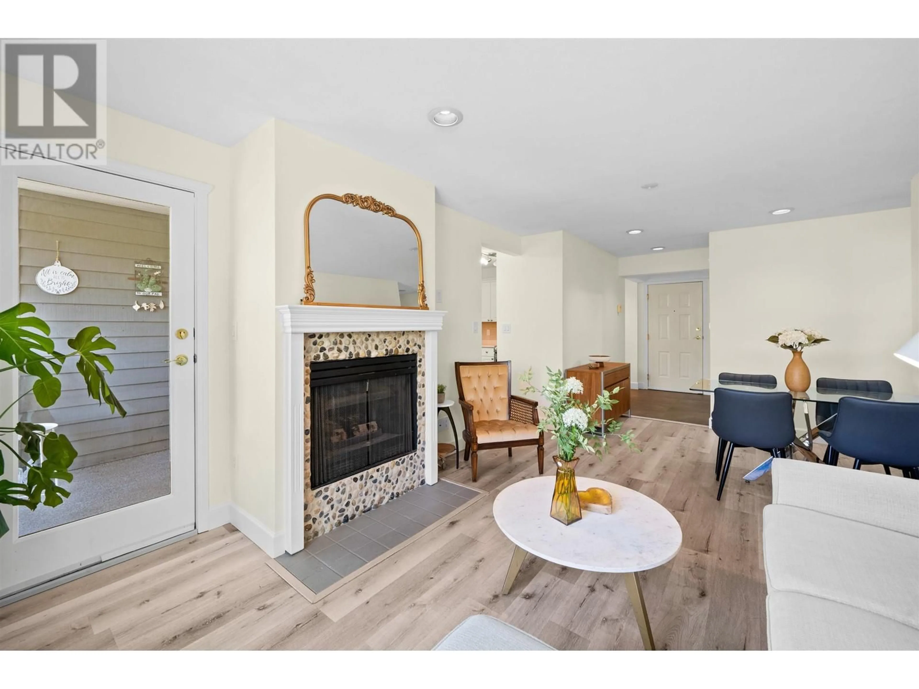 Living room with furniture, wood/laminate floor for 204 - 1528 BOWSER AVENUE, North Vancouver British Columbia V7P2Y3