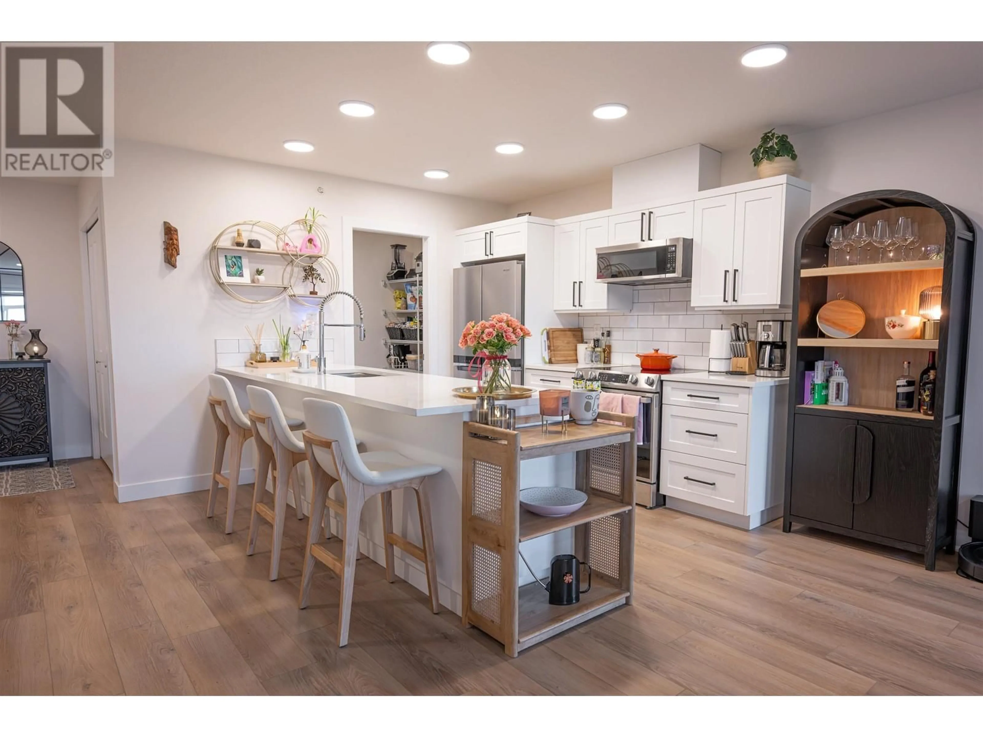 Open concept kitchen, wood/laminate floor for 404 - 4278 22ND AVENUE, Prince George British Columbia V2N0J4