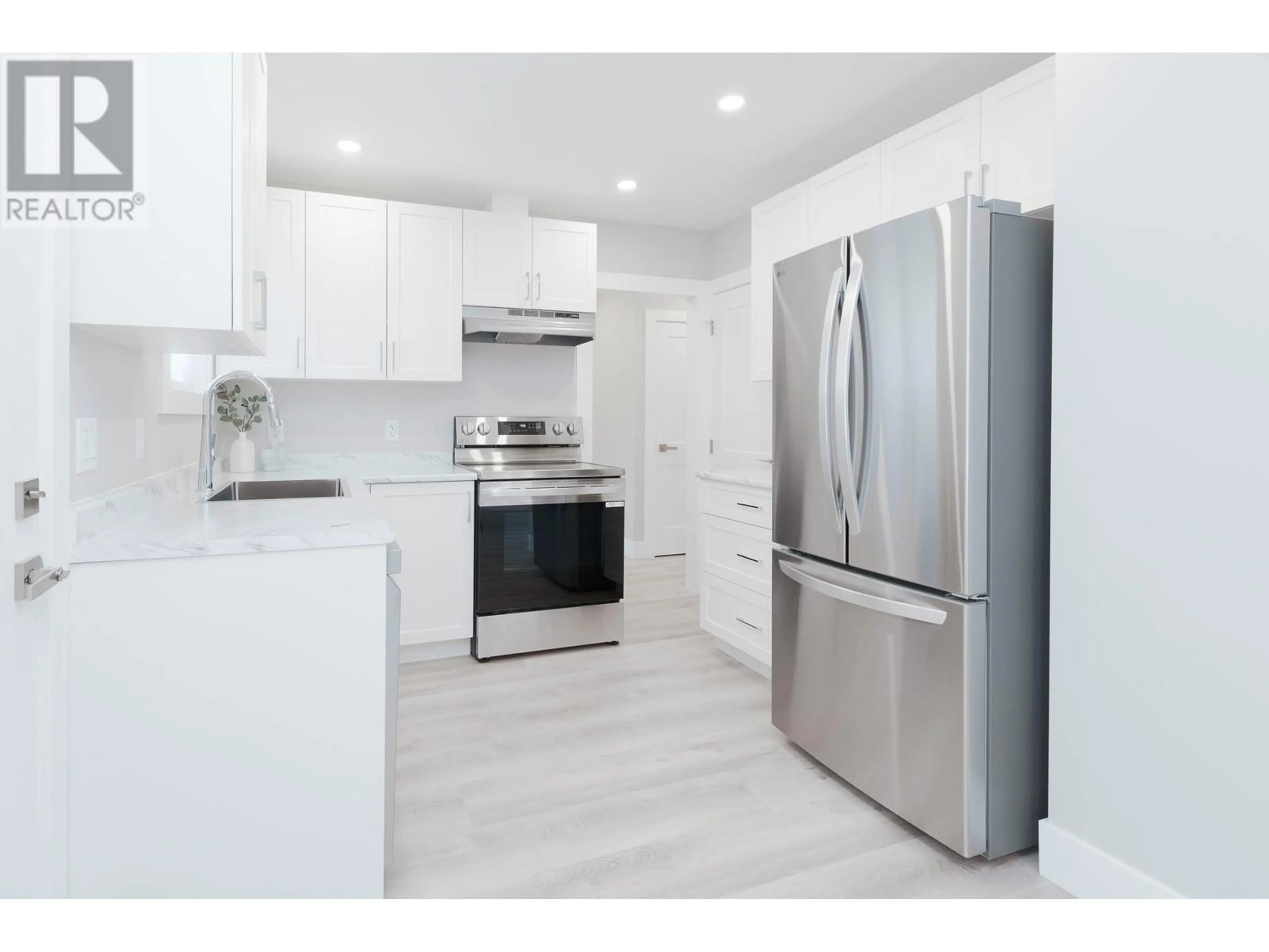 Open concept kitchen, wood/laminate floor for 7987 GRAHAM AVENUE, Burnaby British Columbia V3N1V8