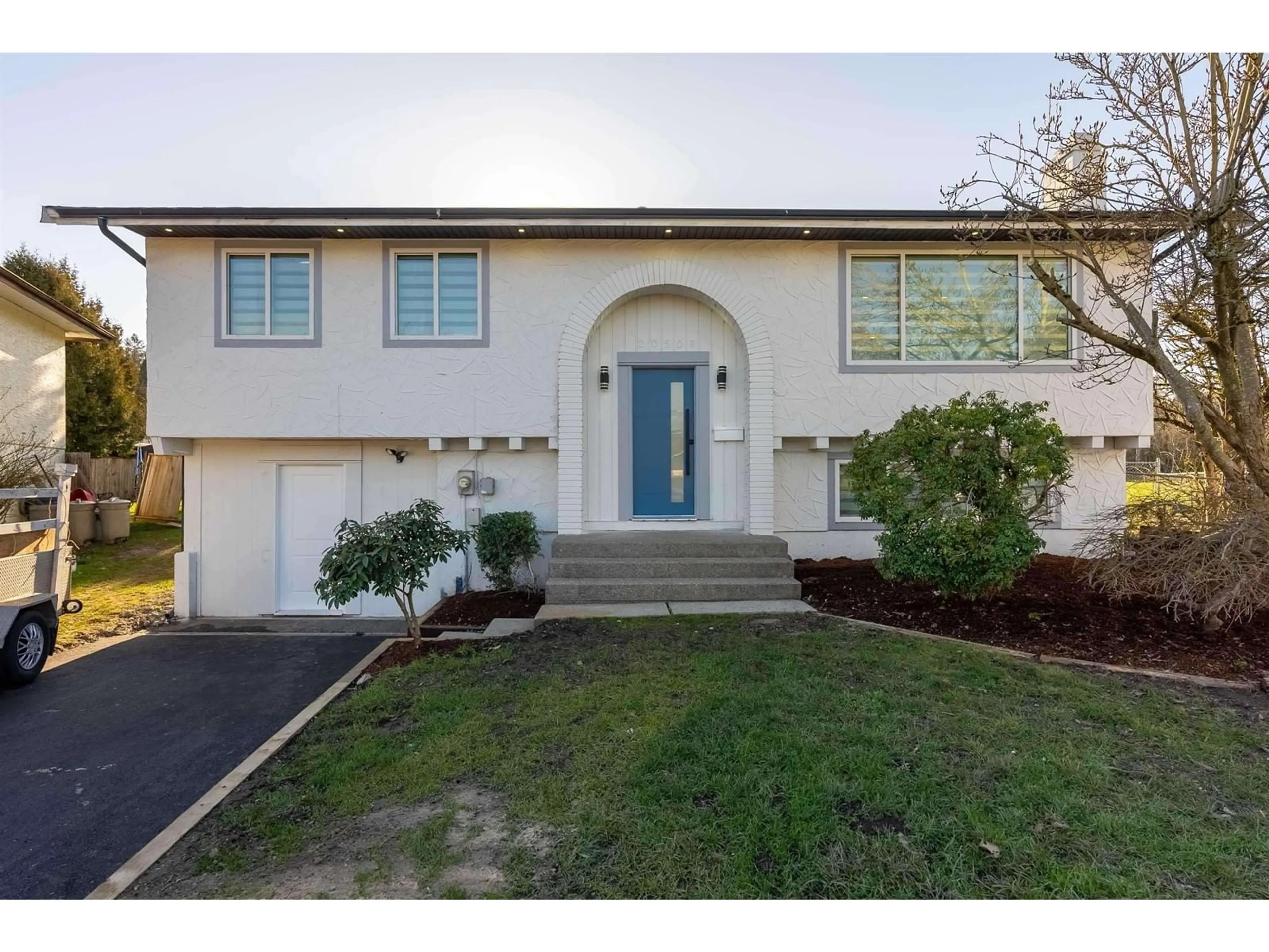 Home with vinyl exterior material, street for 20506 48B, Langley British Columbia V3A5P2