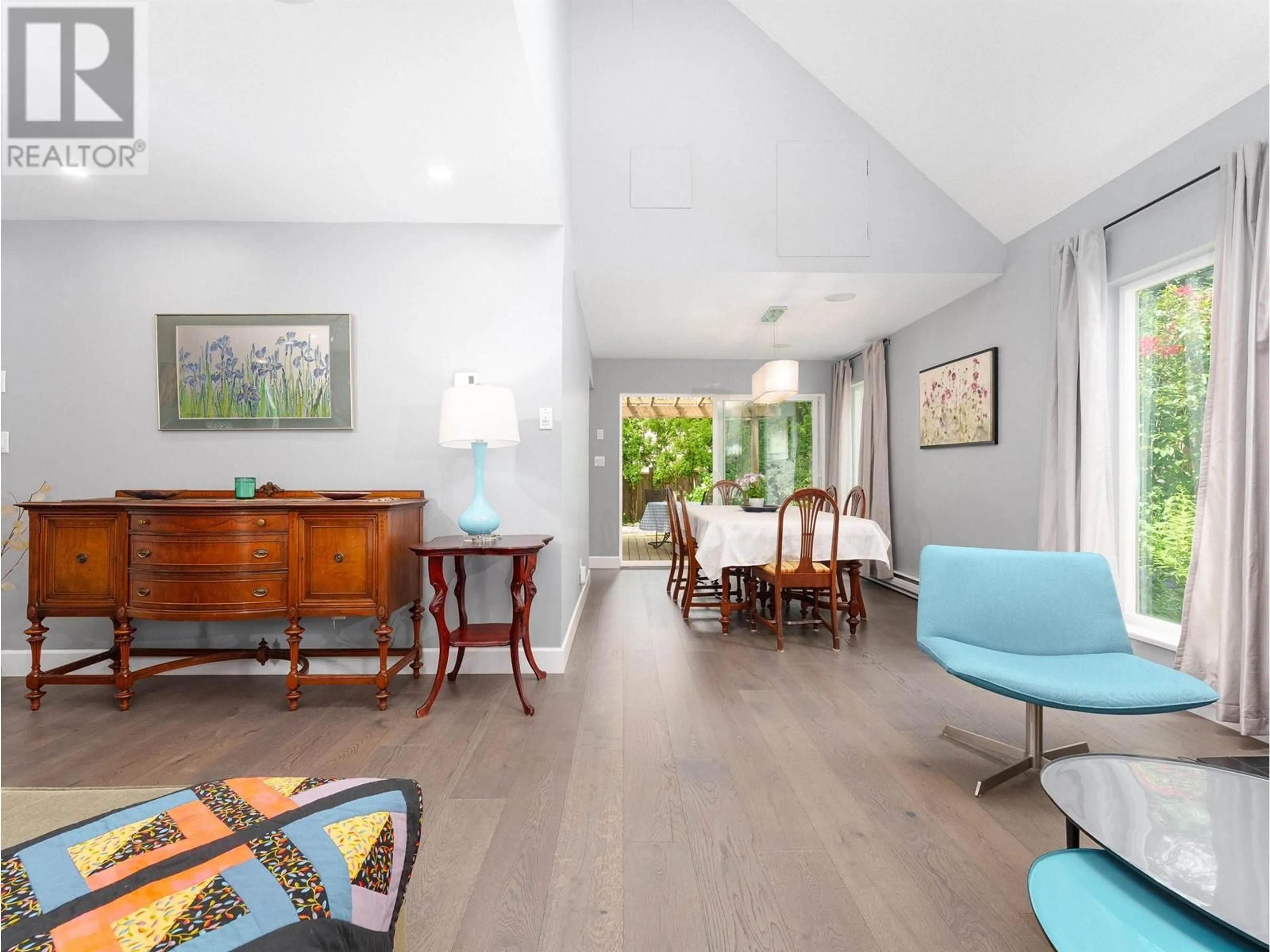 Living room with furniture, wood/laminate floor for 7433 TAMARIND DRIVE, Vancouver British Columbia V5S3Z9
