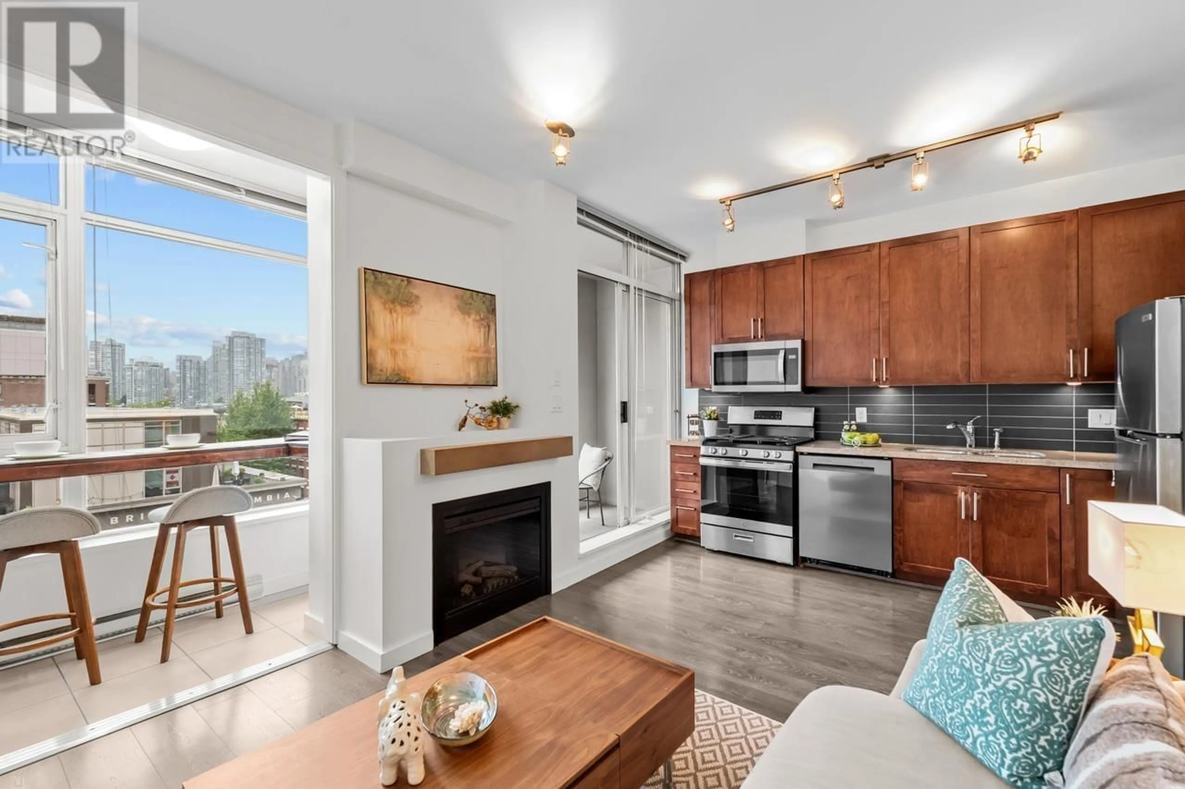Open concept kitchen, wood/laminate floor for 509 - 2055 YUKON STREET, Vancouver British Columbia V5Y4B7