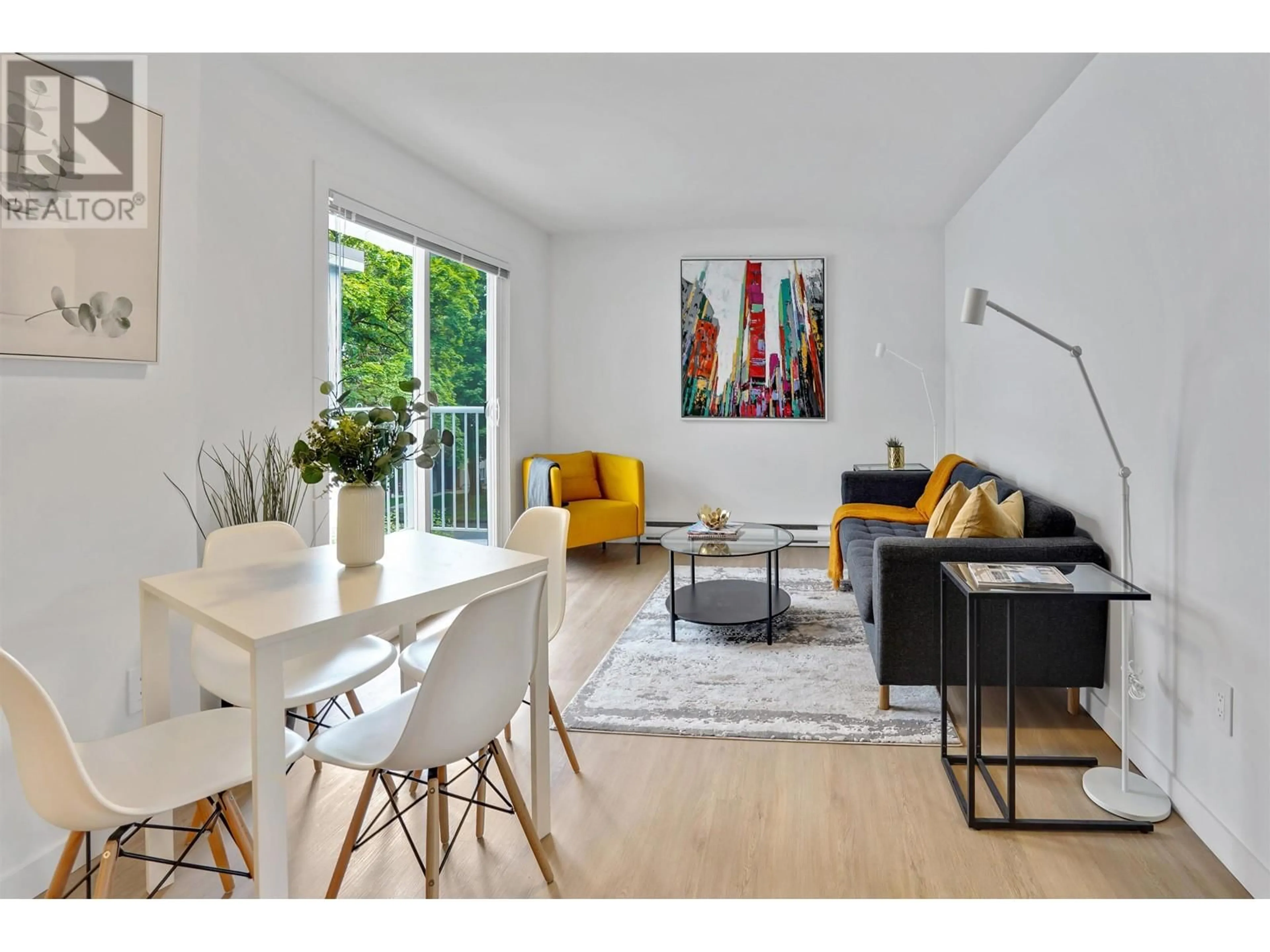 Living room with furniture, wood/laminate floor for 203 - 8690 MONTCALM STREET, Vancouver British Columbia V6P4P8