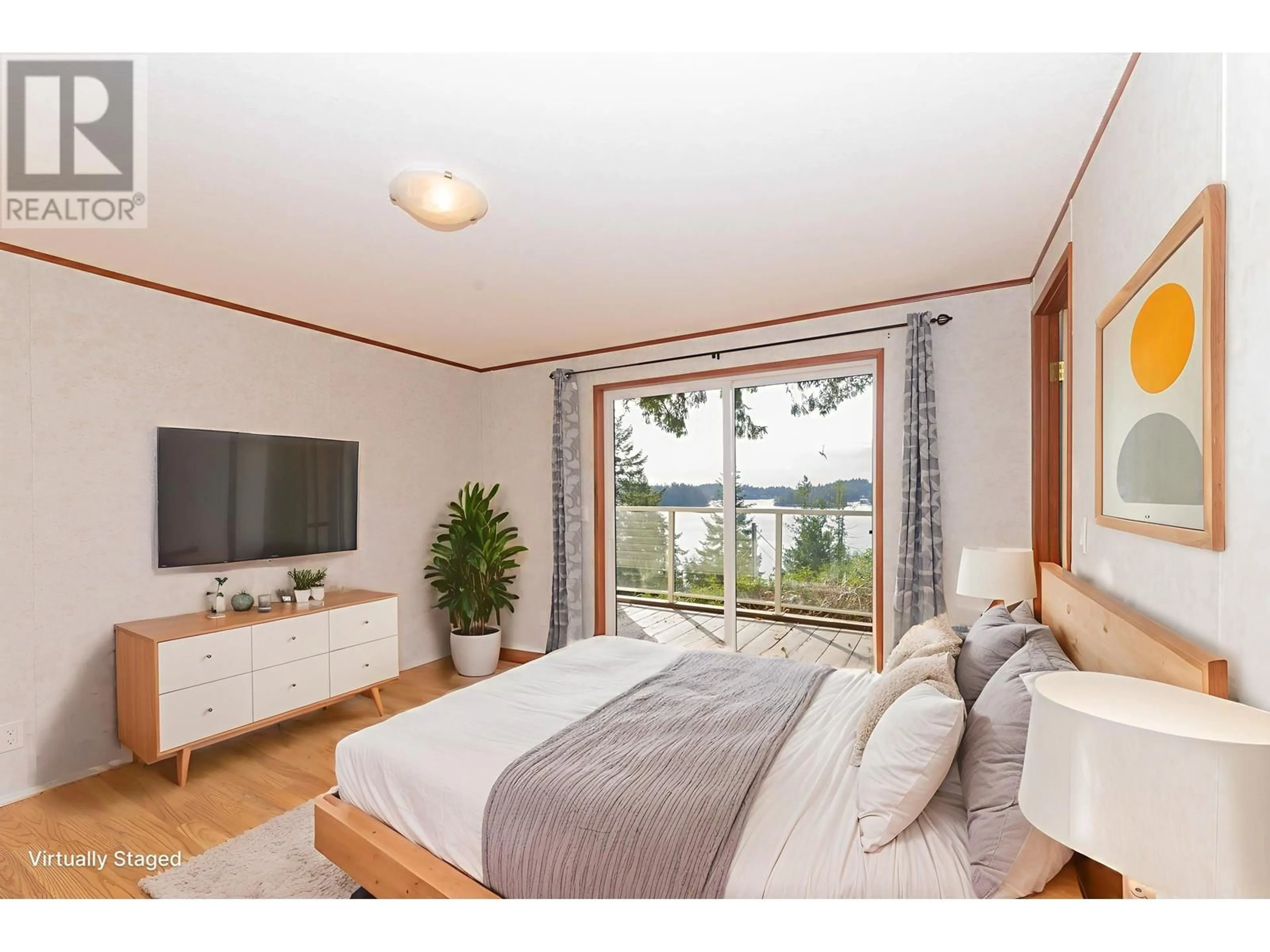 Bedroom with bed, wood/laminate floor for 4799 SINCLAIR BAY ROAD, Pender Harbour British Columbia V0N1S1