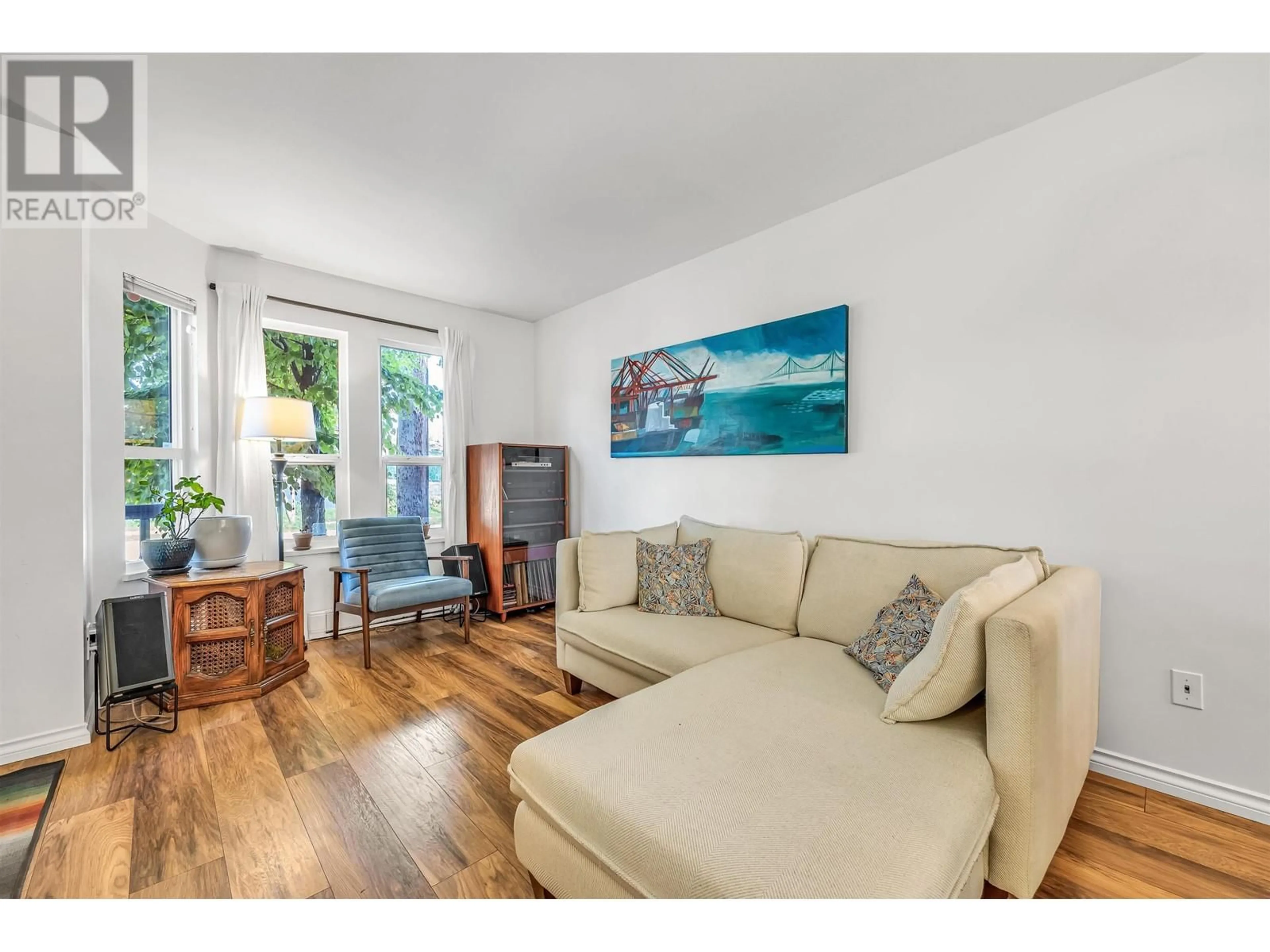 Living room with furniture, wood/laminate floor for 683 GLEN DRIVE, Vancouver British Columbia V6A4E5