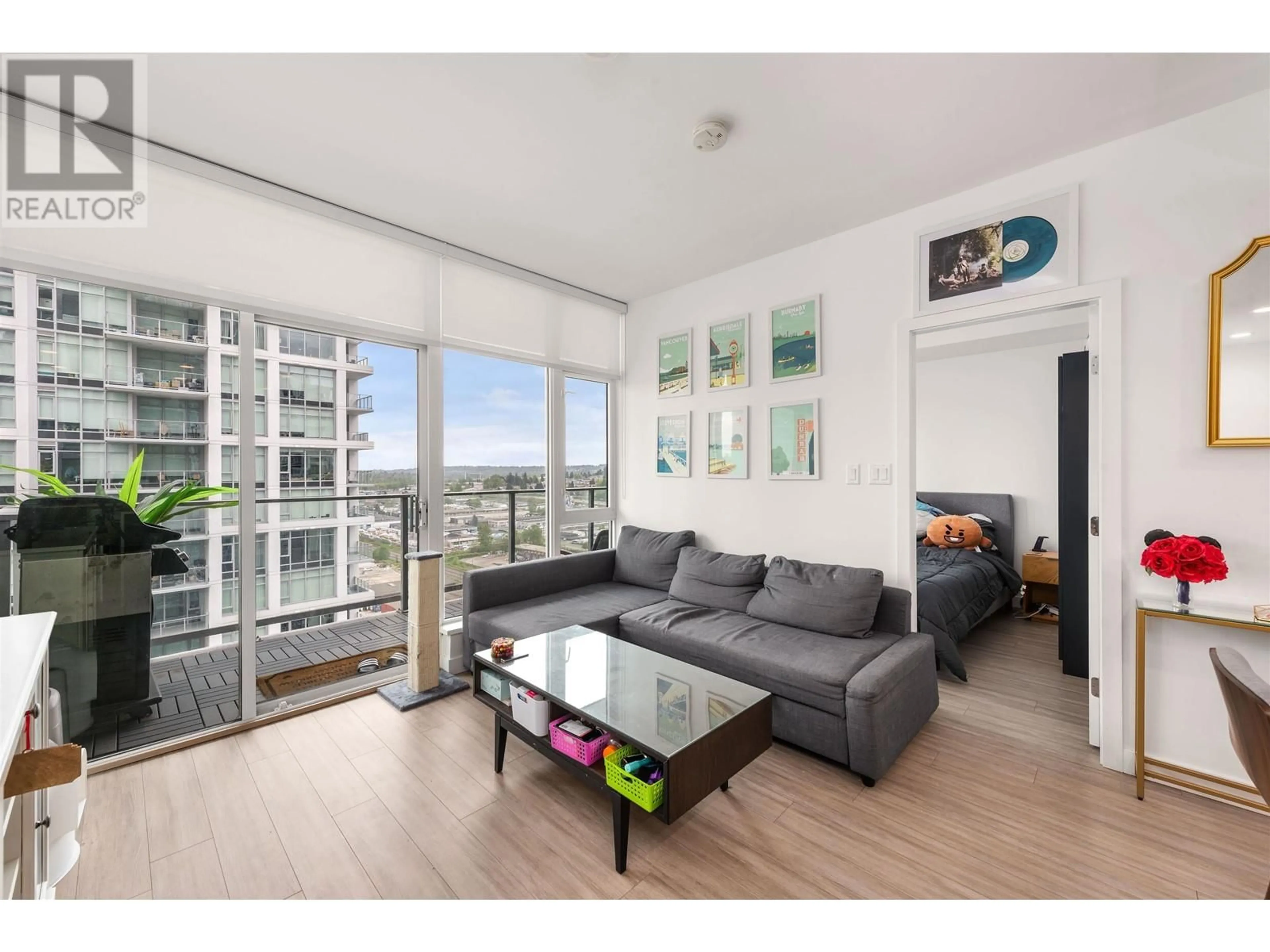 Living room with furniture, wood/laminate floor for 2104 - 2311 BETA AVENUE, Burnaby British Columbia V5C0M1