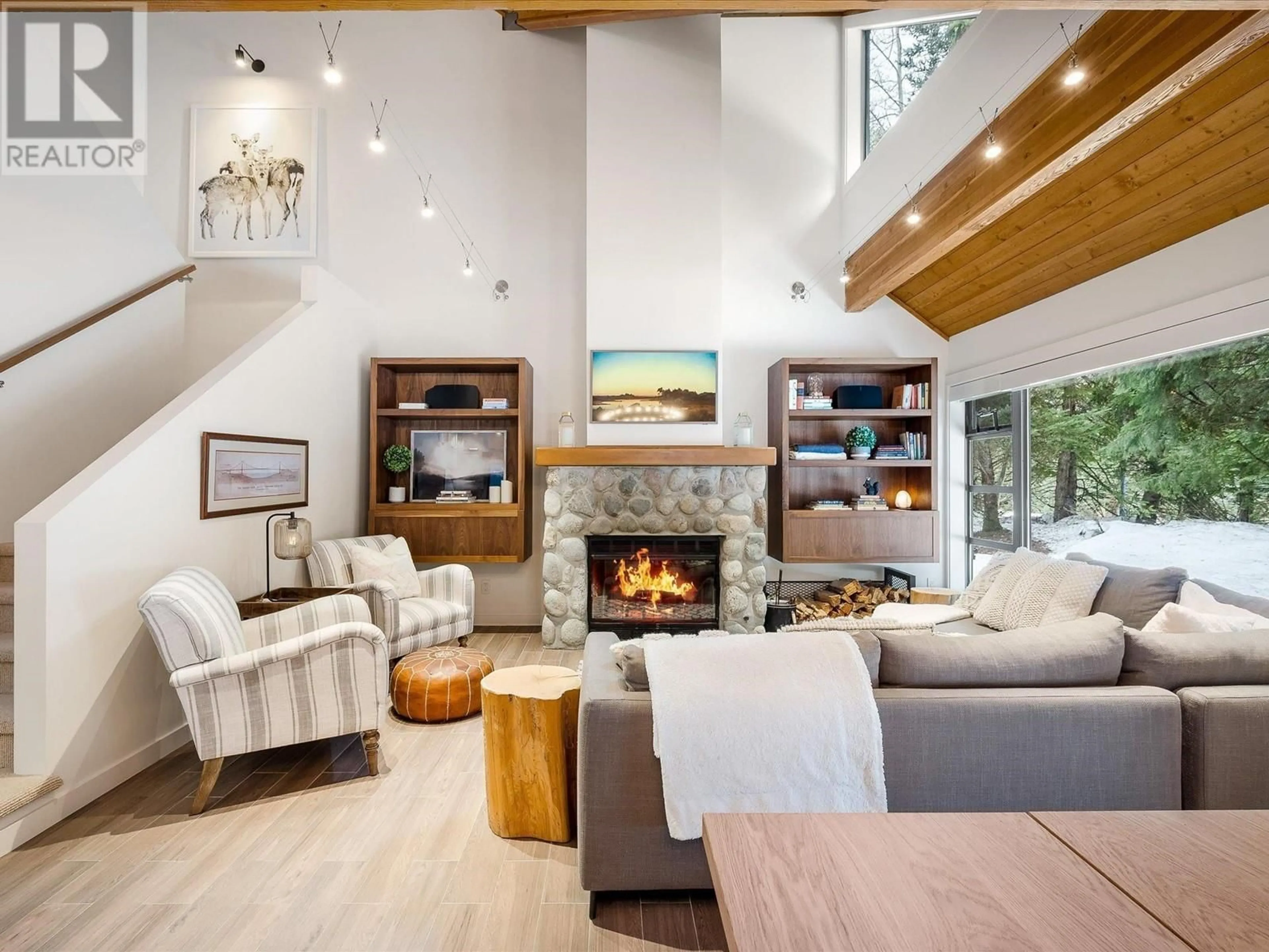 Living room with furniture, wood/laminate floor for 4632 MONTEBELLO PLACE, Whistler British Columbia V8E0Z4