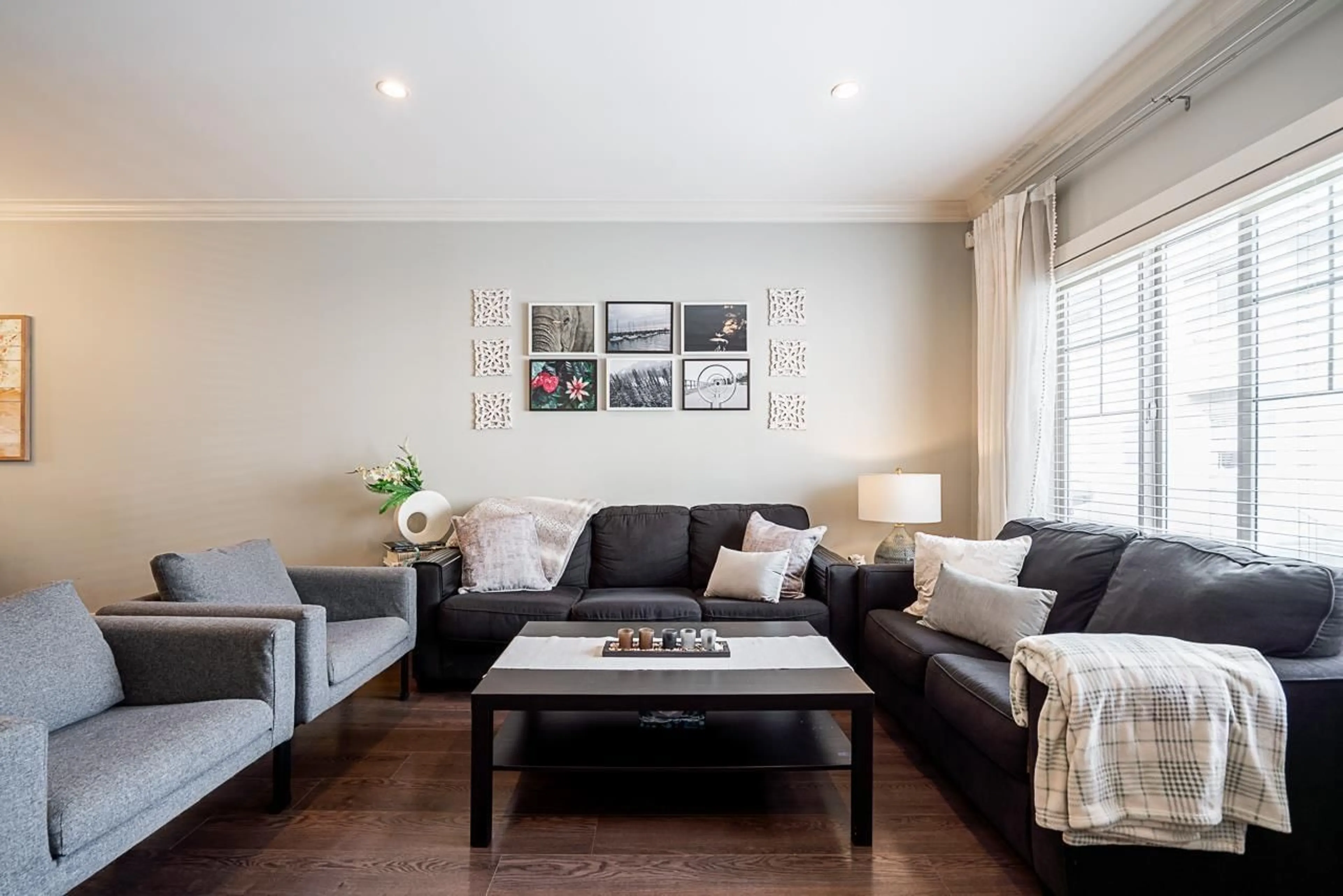 Living room with furniture, wood/laminate floor for 18 - 19097 64, Surrey British Columbia V3S6X5