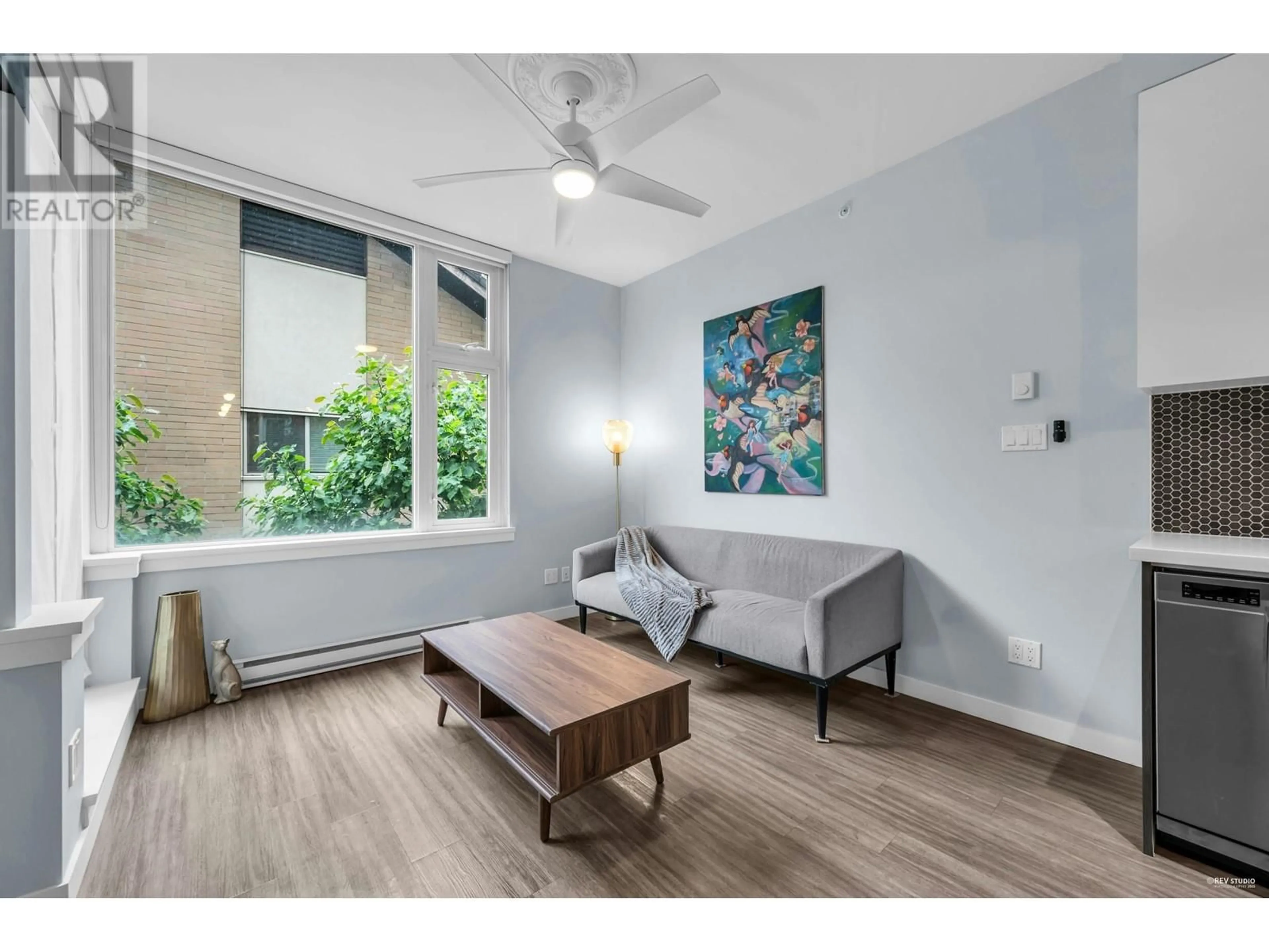 Living room with furniture, wood/laminate floor for 206 - 311 6TH AVENUE, Vancouver British Columbia V5T1J9