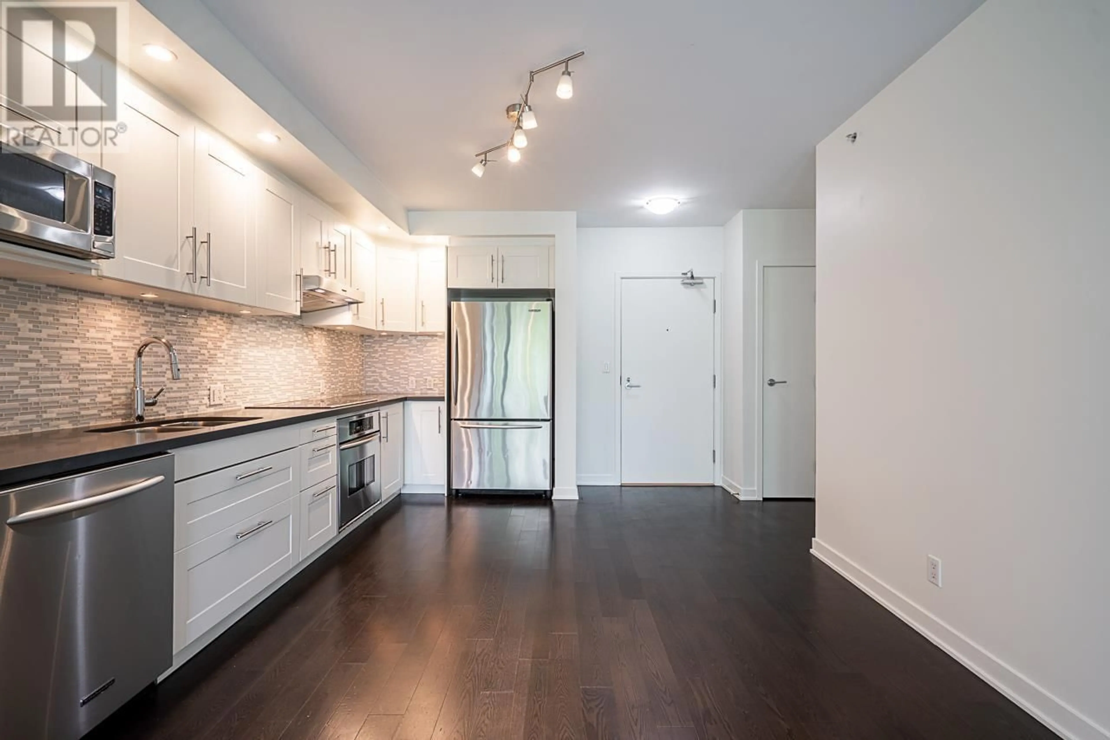 Open concept kitchen, wood/laminate floor for 310 - 750 12TH AVENUE, Vancouver British Columbia V5Z0A3