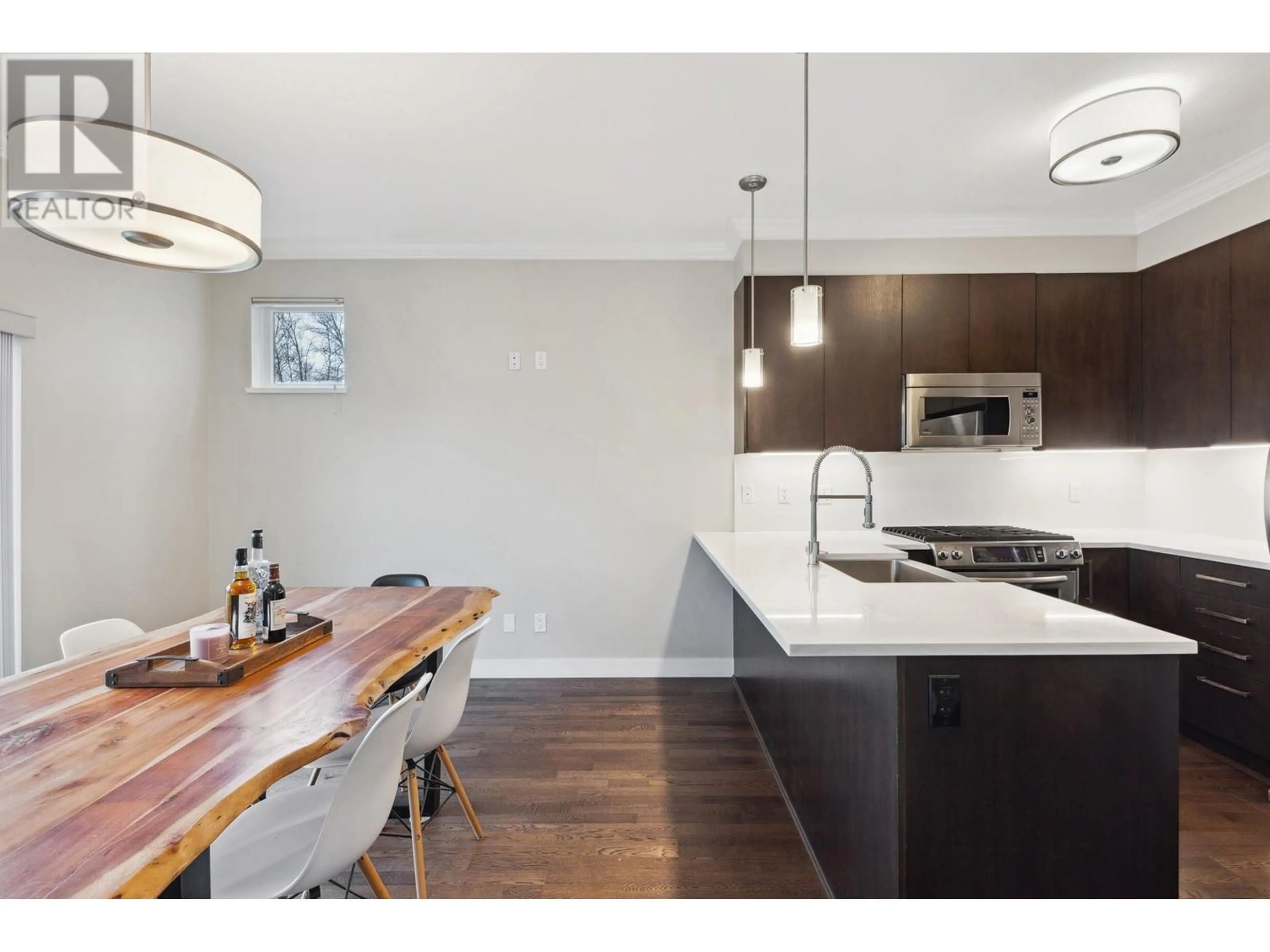 Open concept kitchen, wood/laminate floor for 1107 - 8485 NEW HAVEN CLOSE, Burnaby British Columbia V5J0B7