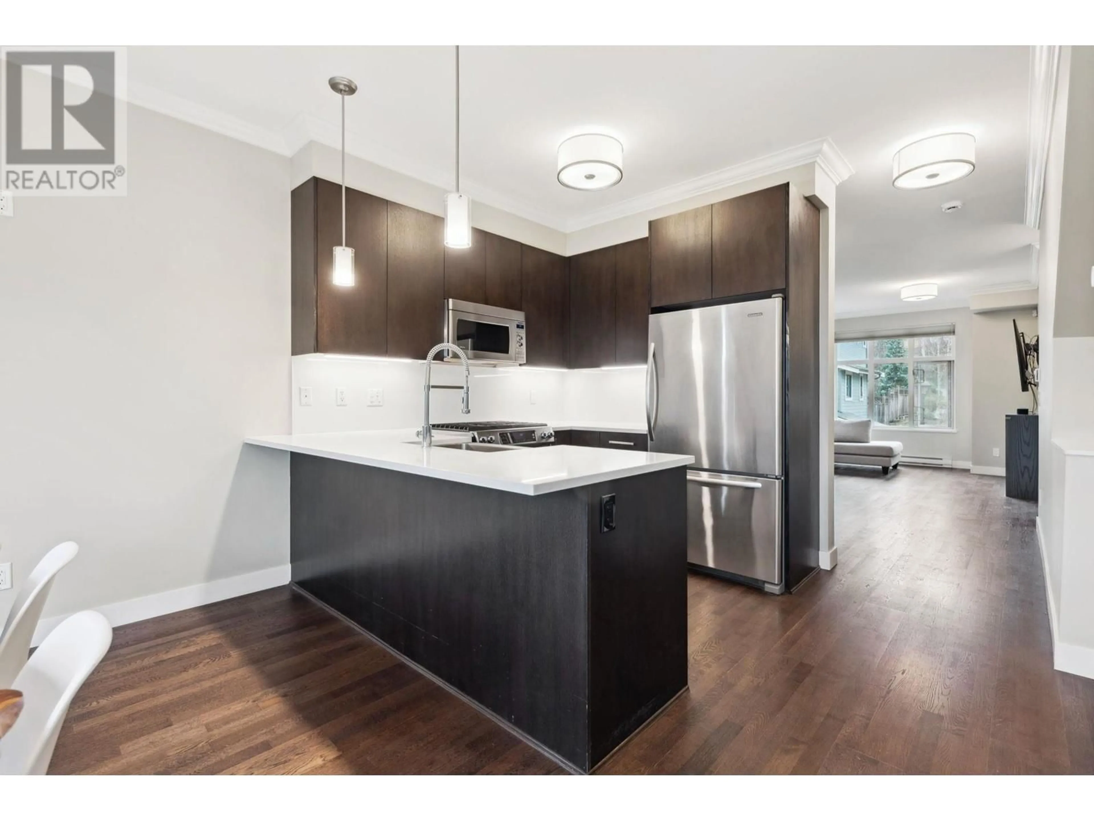 Open concept kitchen, wood/laminate floor for 1107 - 8485 NEW HAVEN CLOSE, Burnaby British Columbia V5J0B7