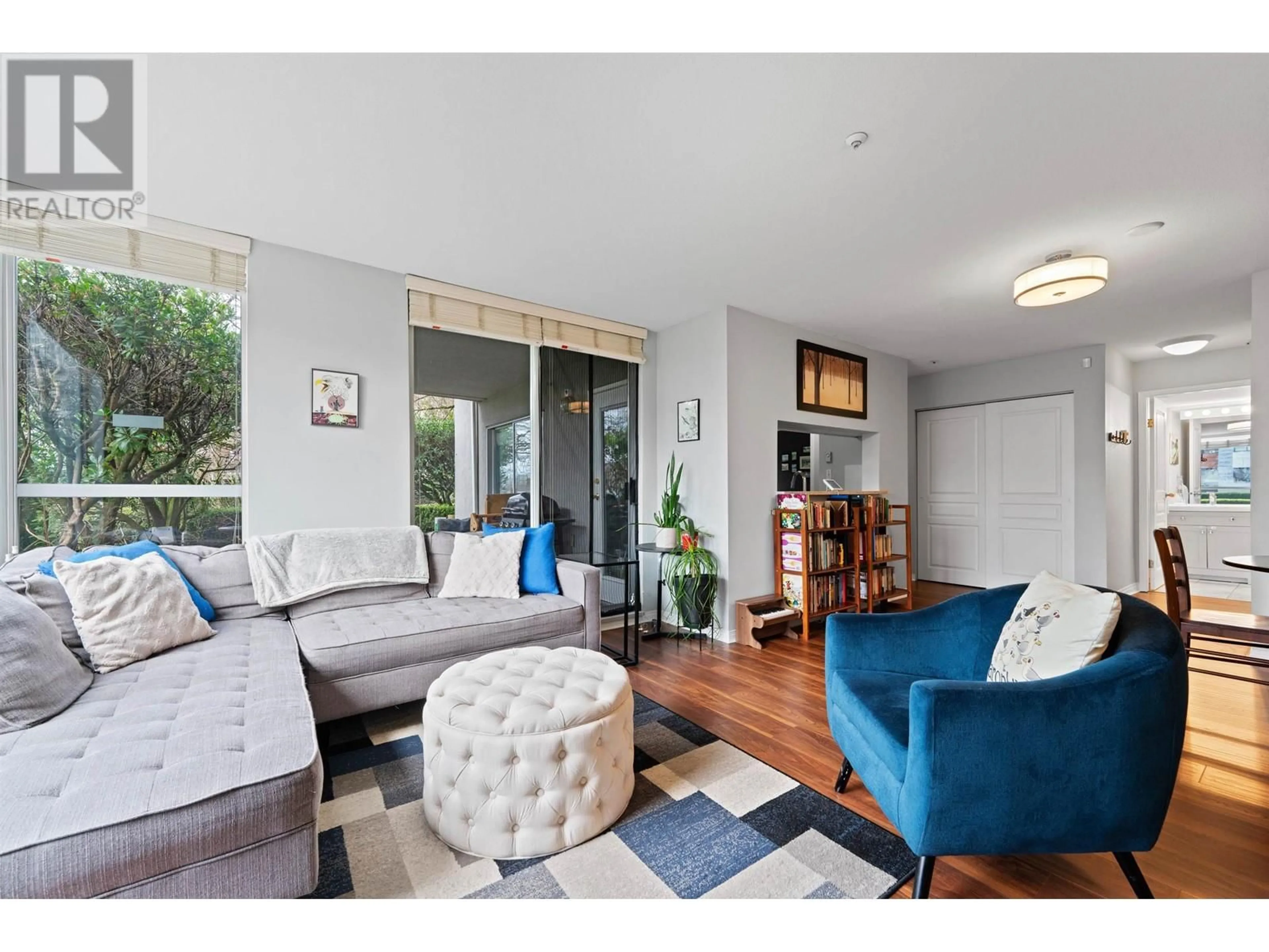 Living room with furniture, wood/laminate floor for 5 - 8460 JELLICOE STREET, Vancouver British Columbia V5S4S8