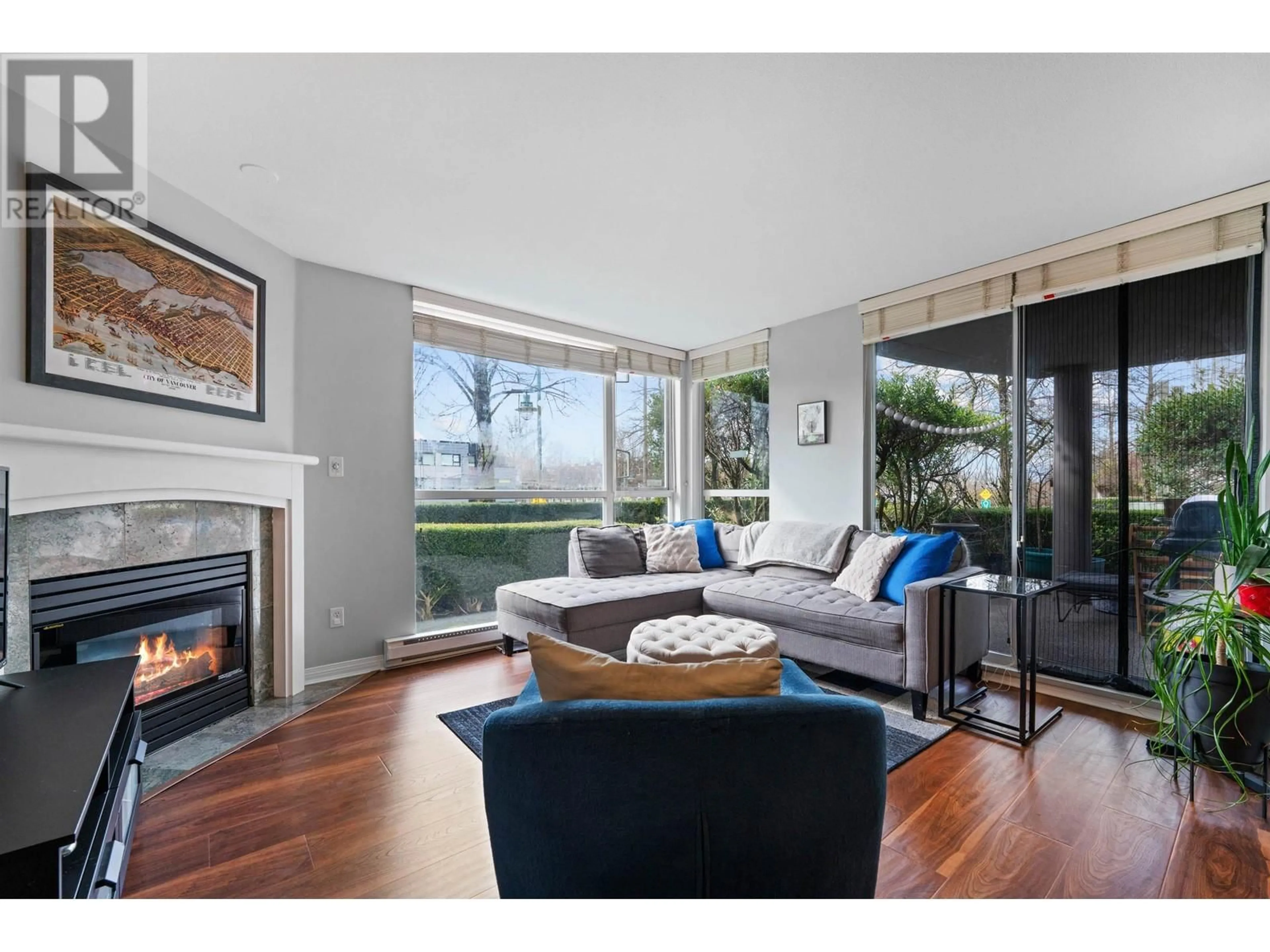 Living room with furniture, wood/laminate floor for 5 - 8460 JELLICOE STREET, Vancouver British Columbia V5S4S8