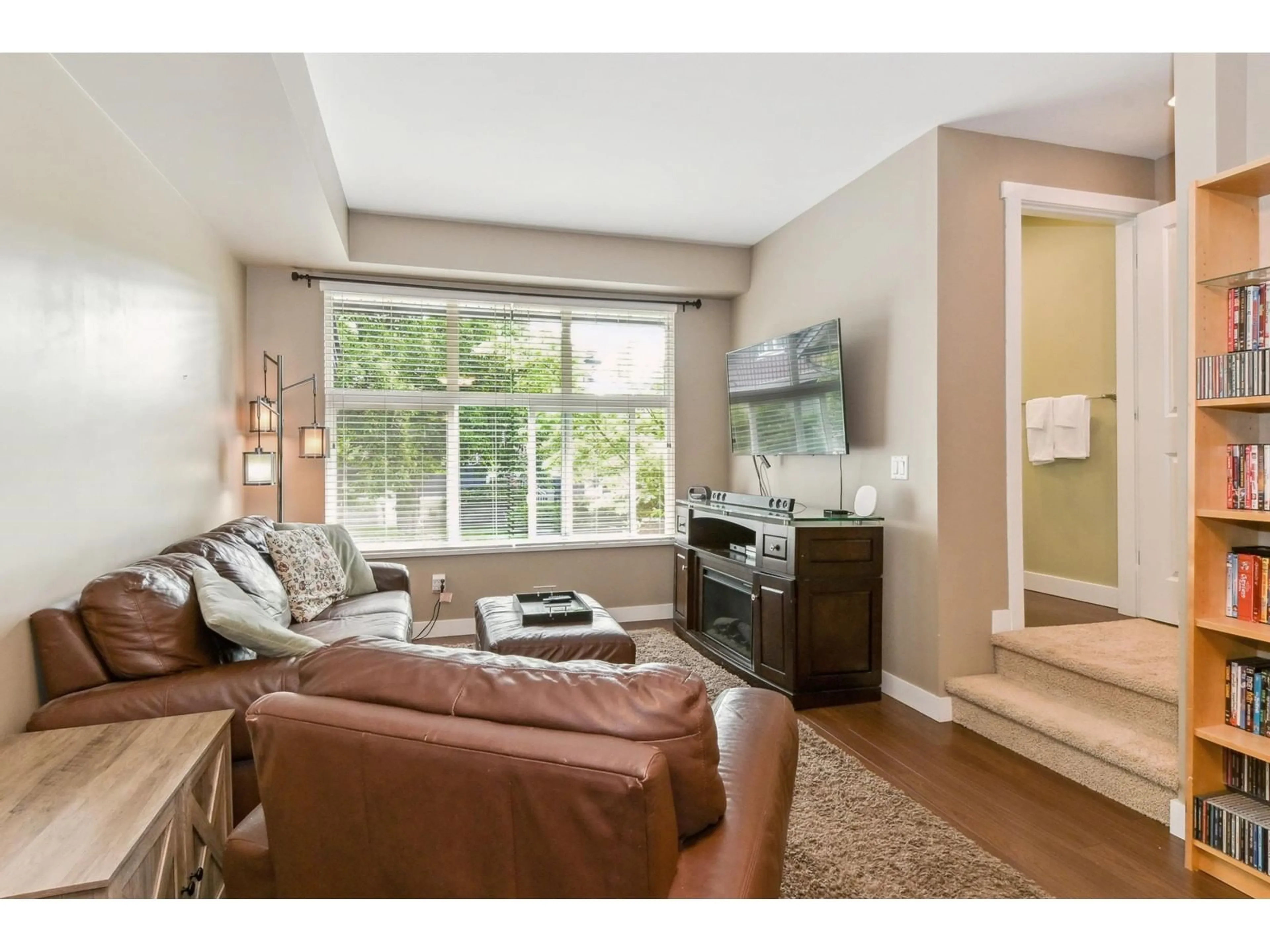 Living room with furniture, wood/laminate floor for 55 - 18199 70, Surrey British Columbia V3S2N9