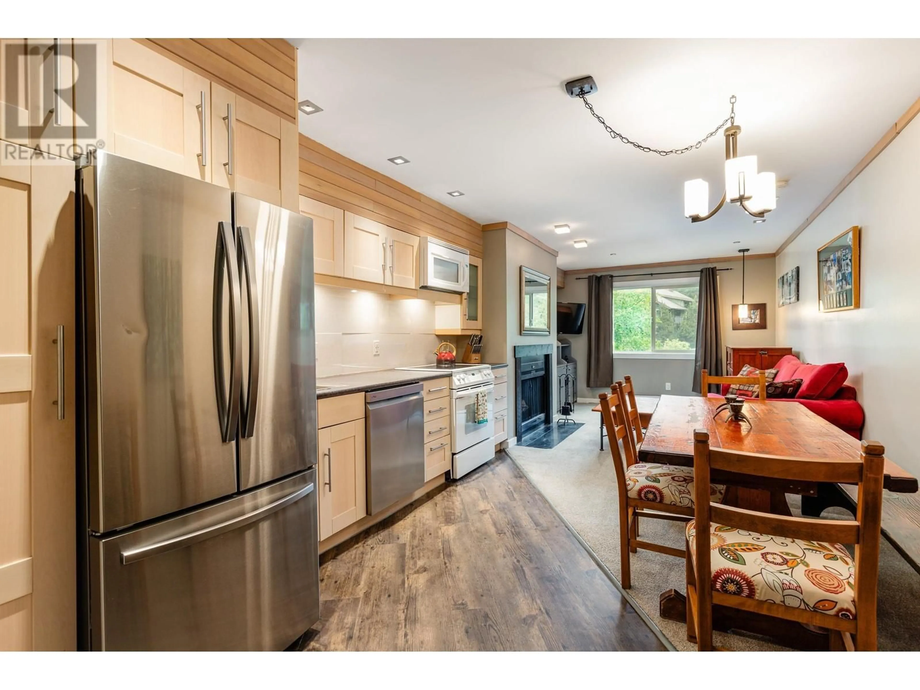 Open concept kitchen, wood/laminate floor for 105 - 2021 KAREN CRESCENT, Whistler British Columbia V8E0H1