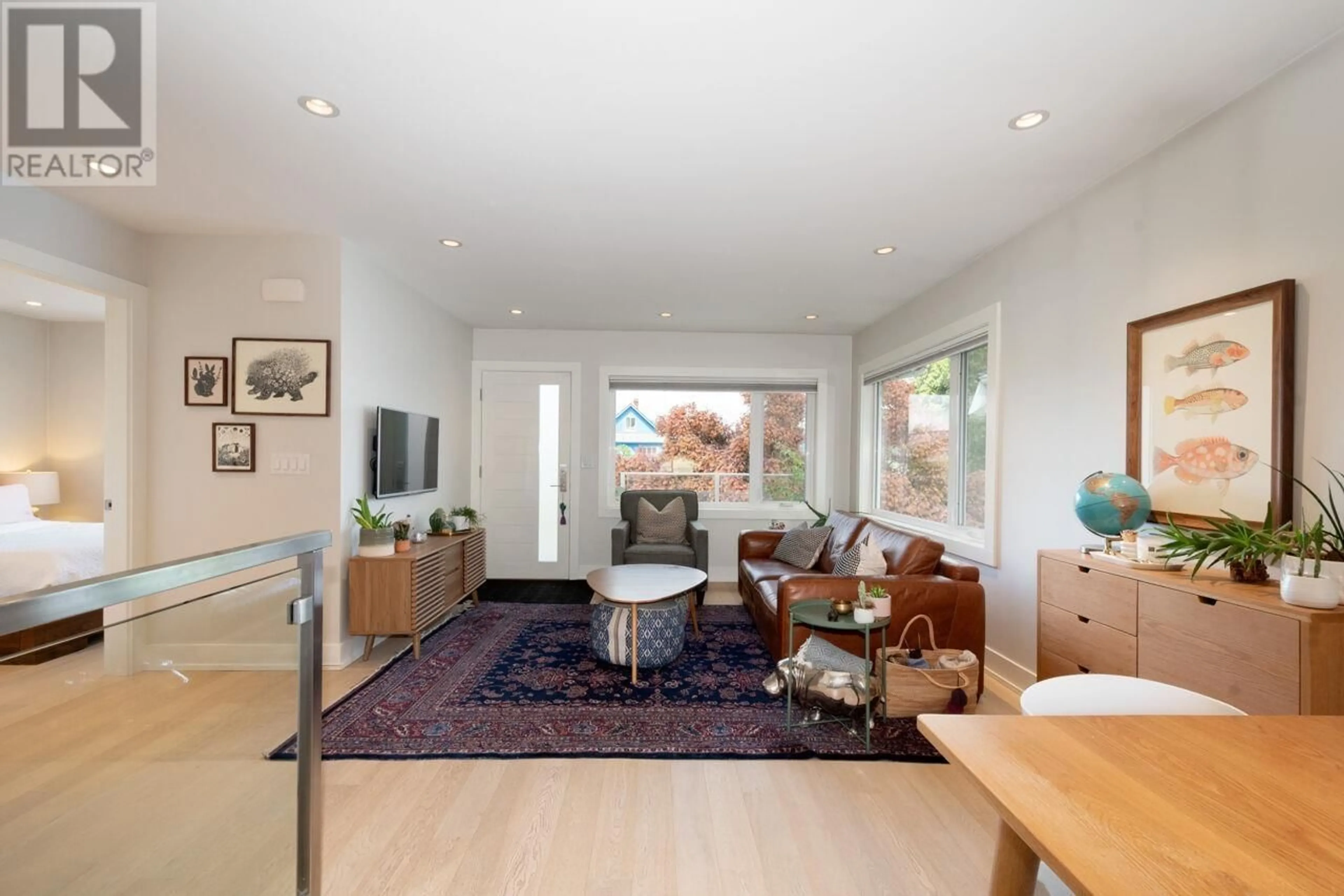 Living room with furniture, wood/laminate floor for 2934 TRINITY STREET, Vancouver British Columbia V5K1G2