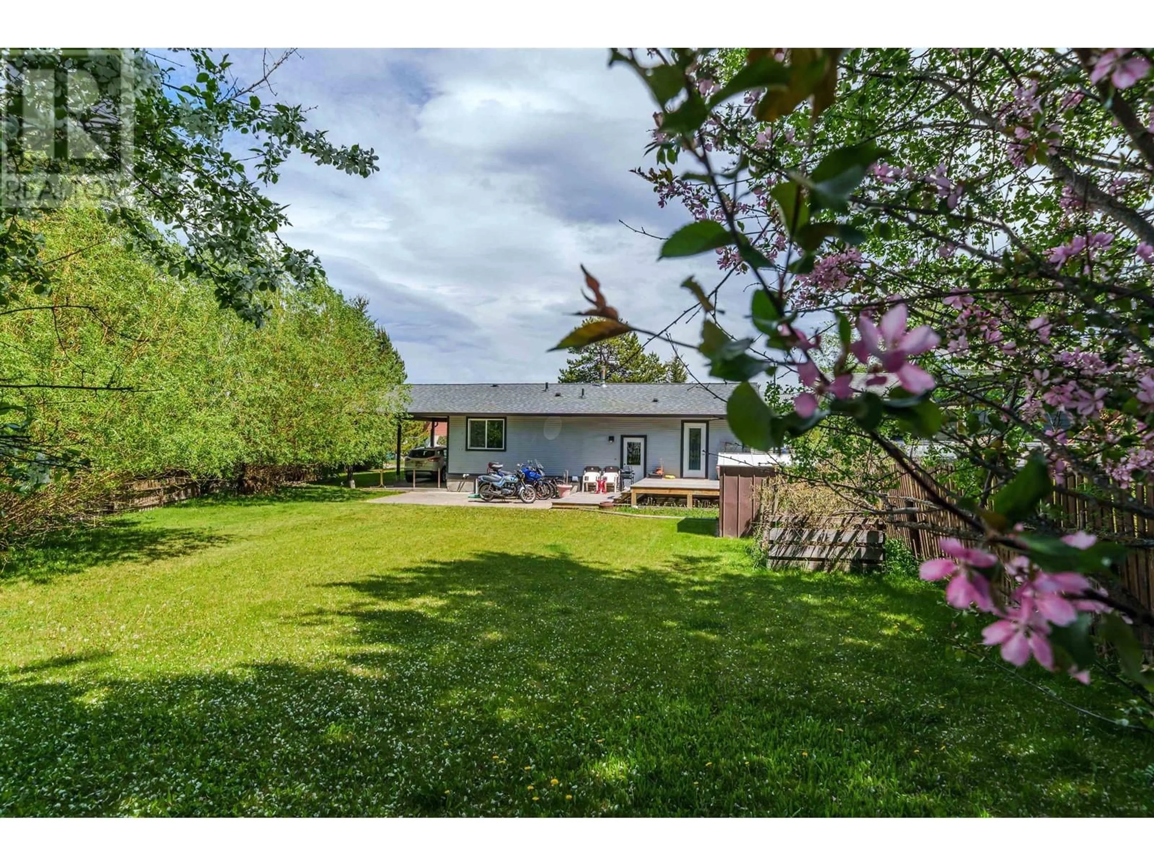 A pic from outside/outdoor area/front of a property/back of a property/a pic from drone, unknown for 488 EVERGREEN CRESCENT, 100 Mile House British Columbia V0K2E0