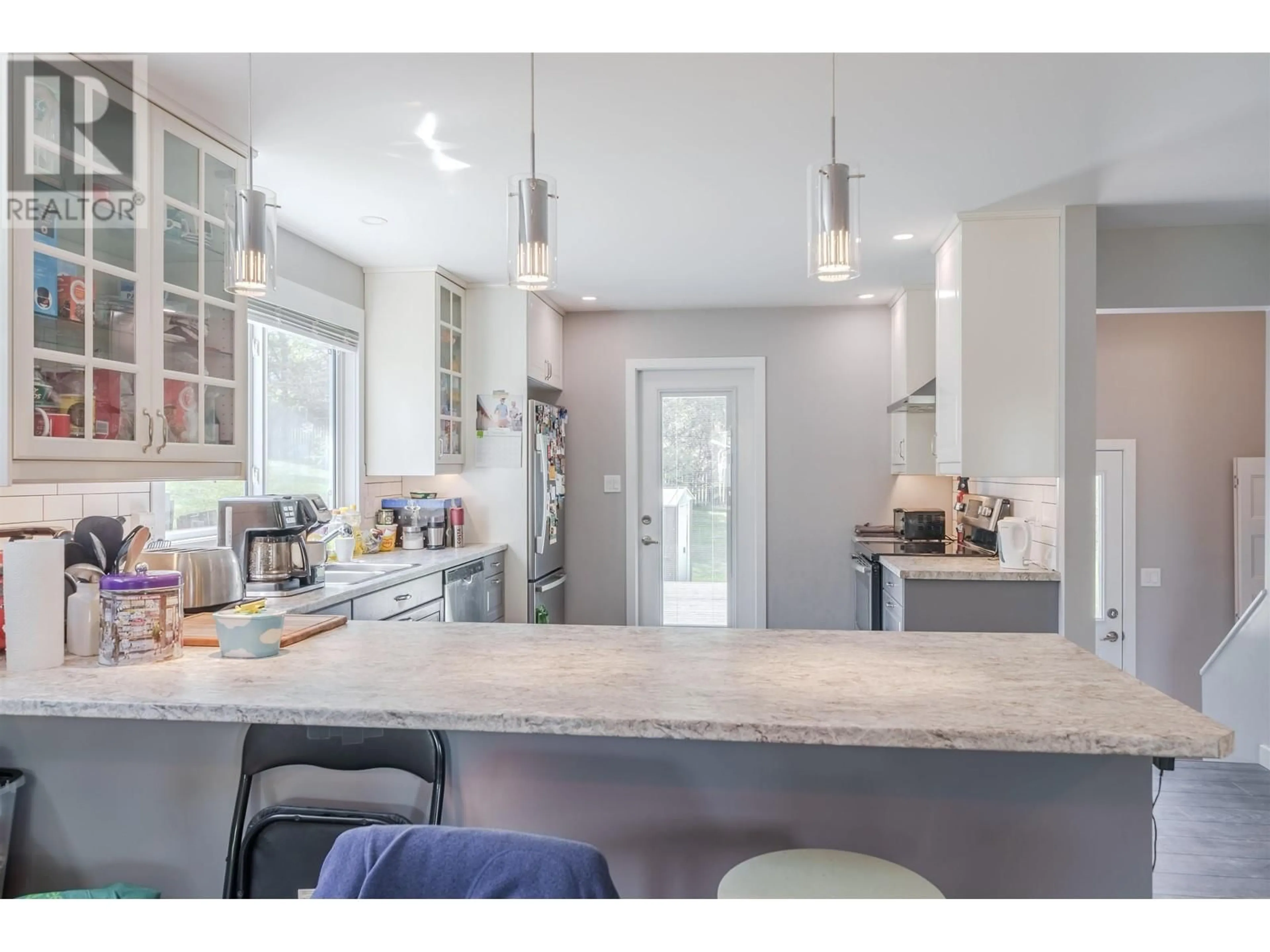 Open concept kitchen, unknown for 488 EVERGREEN CRESCENT, 100 Mile House British Columbia V0K2E0