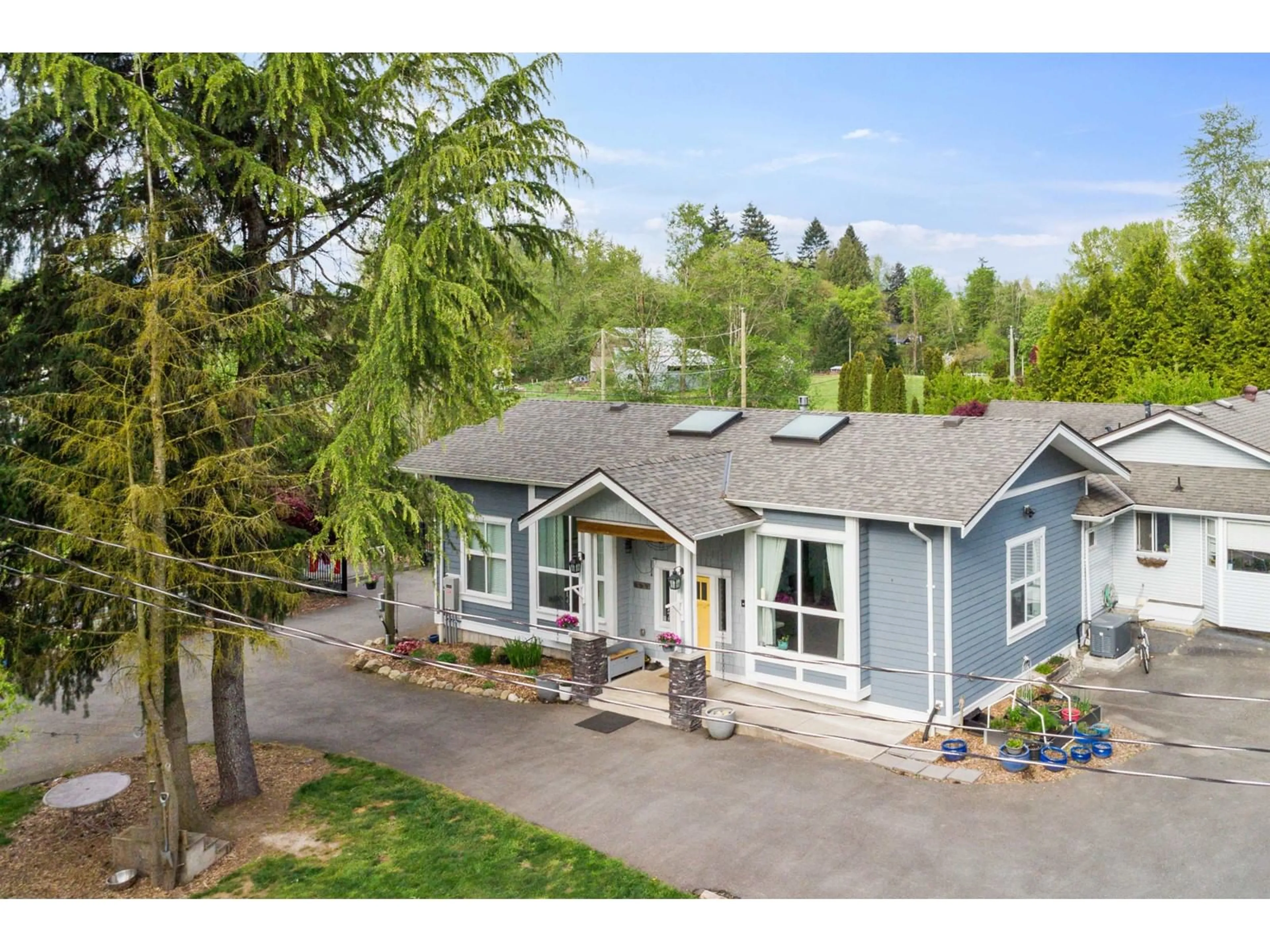 A pic from outside/outdoor area/front of a property/back of a property/a pic from drone, street for 6063 256, Langley British Columbia V4W1K1