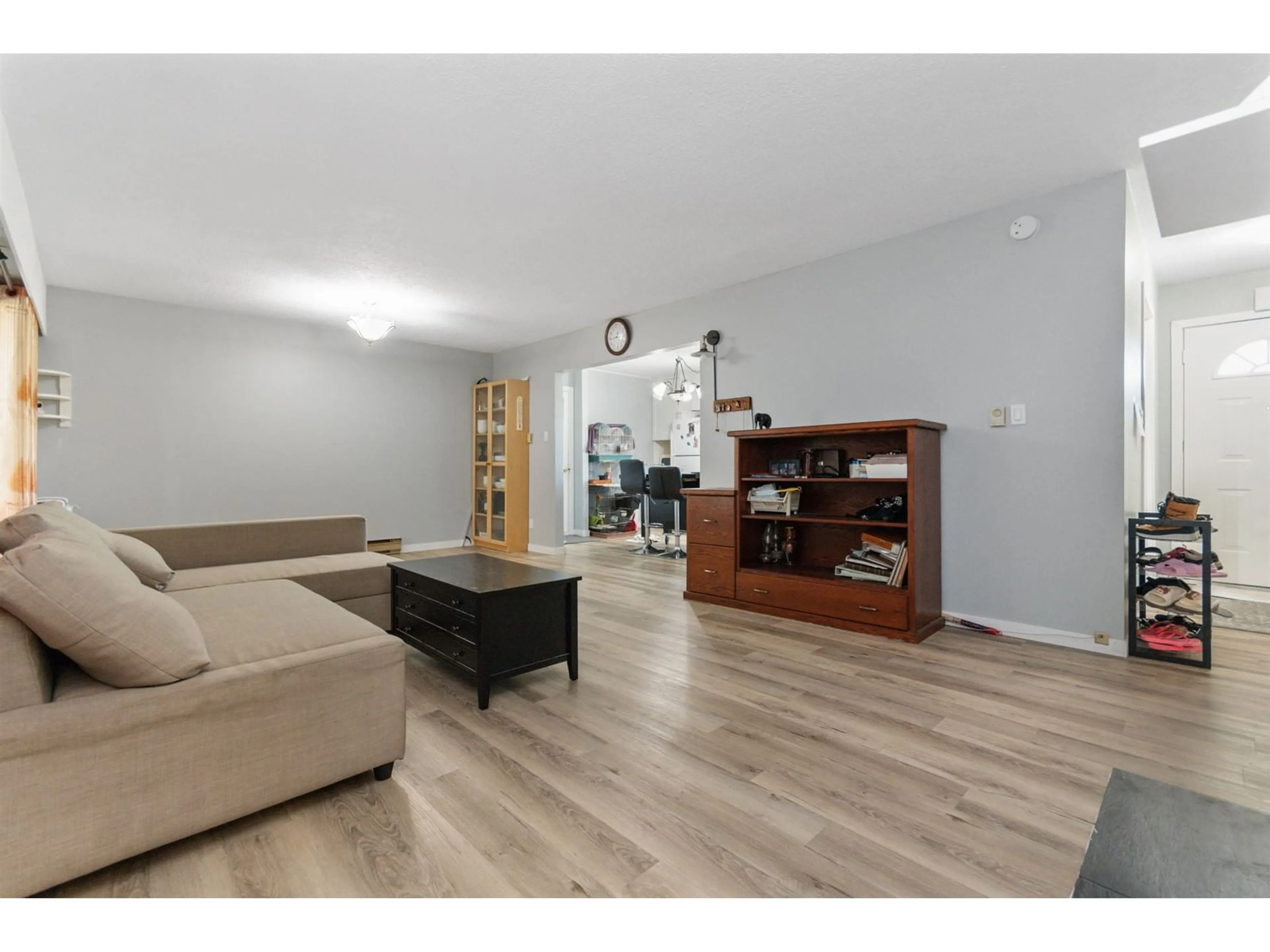 Living room with furniture, wood/laminate floor for 8684 BROADWAY ROAD, Chilliwack British Columbia V2P5V6