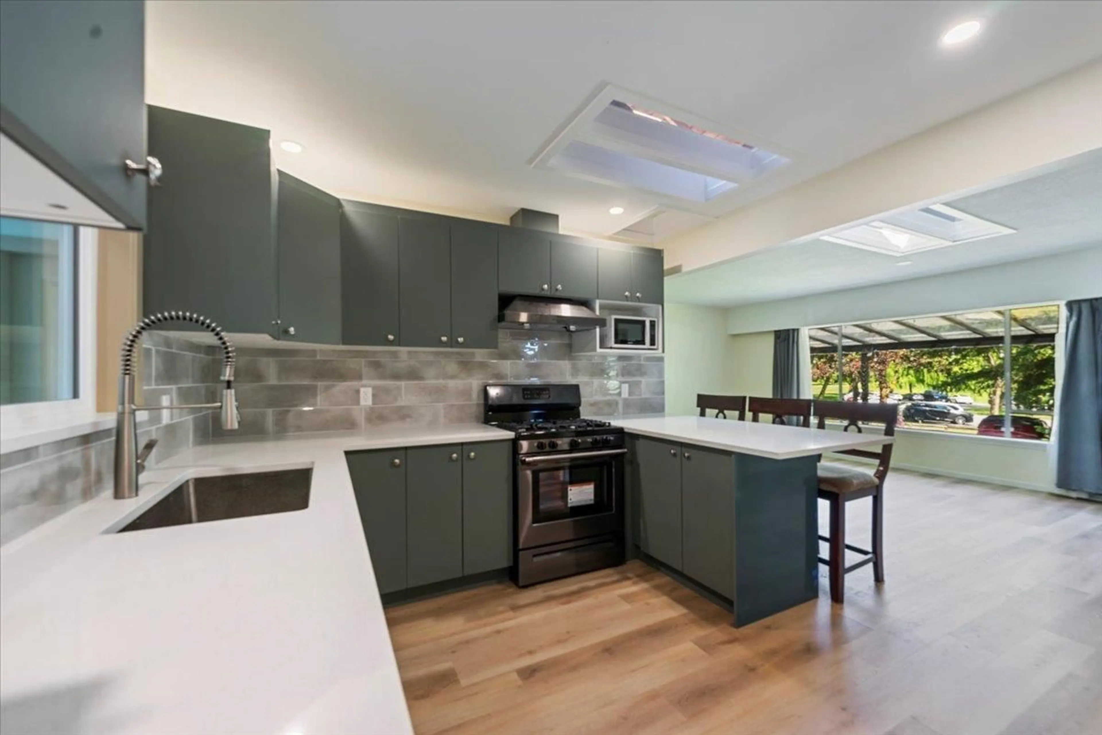 Contemporary kitchen, ceramic/tile floor for 12930 OLD YALE, Surrey British Columbia V3T3B7