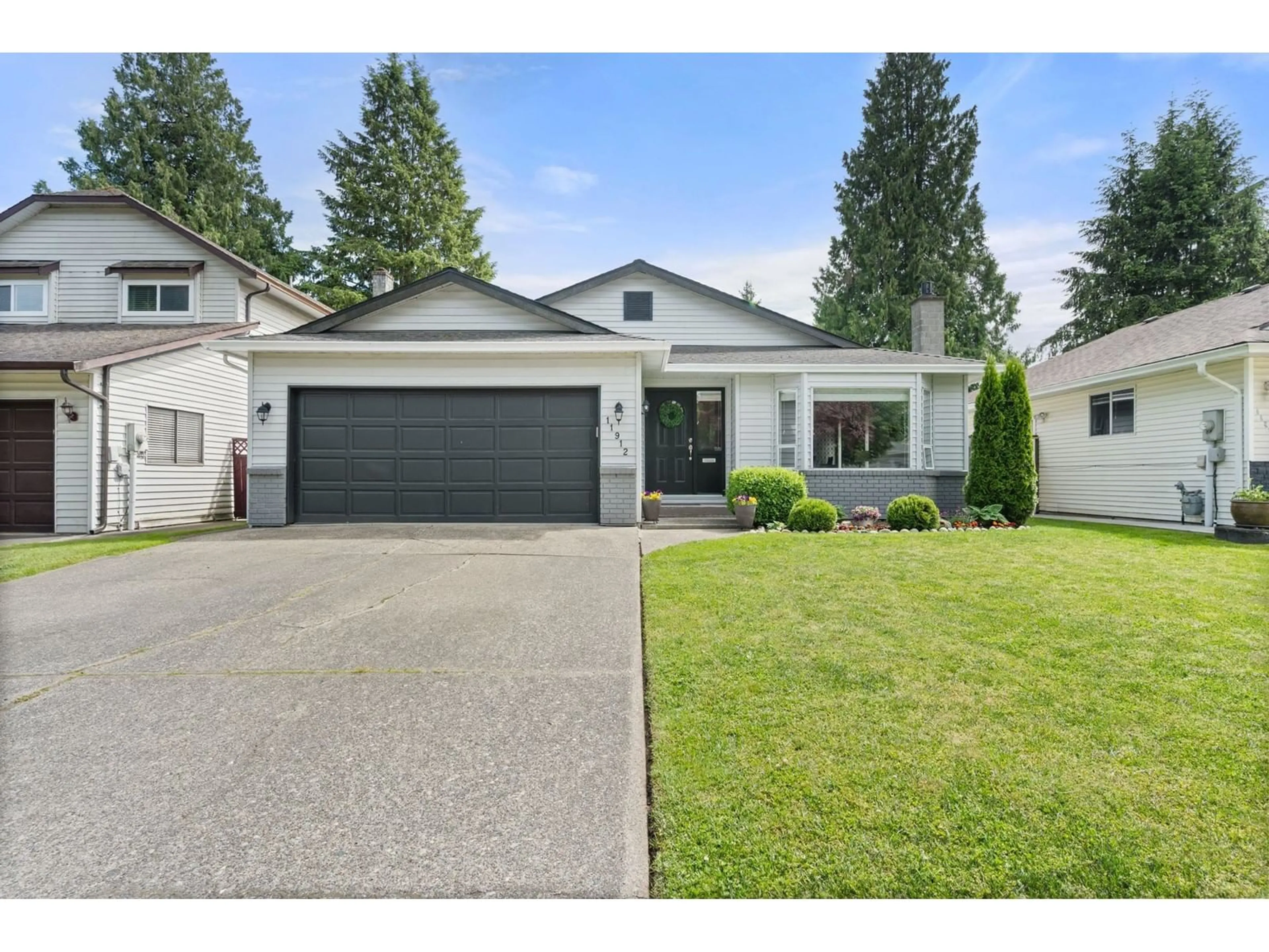 Home with vinyl exterior material, street for 11912 84A, Delta British Columbia V4C2T4