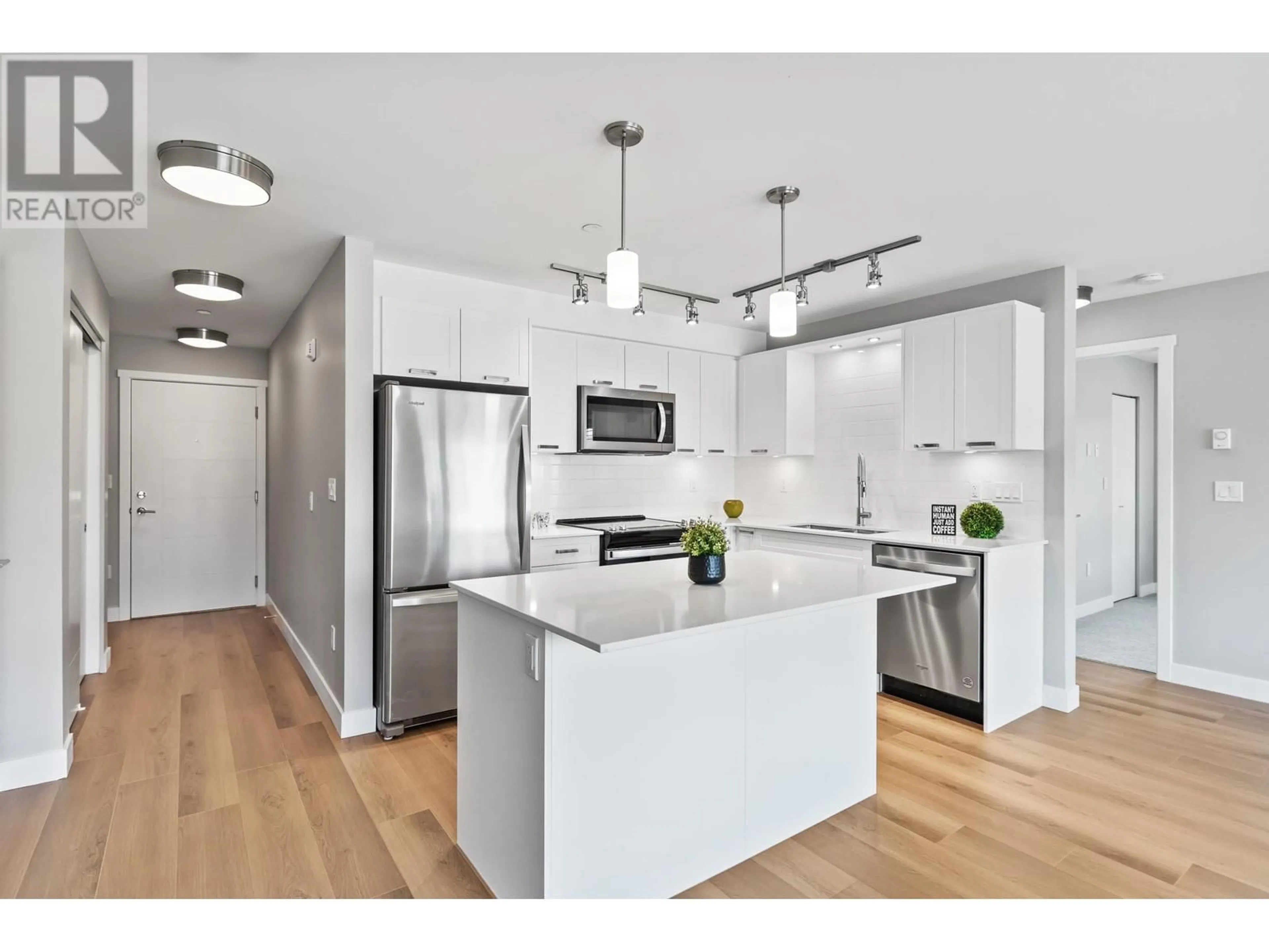 Open concept kitchen, wood/laminate floor for 315 - 22562 121 AVENUE, Maple Ridge British Columbia V2X3Y8
