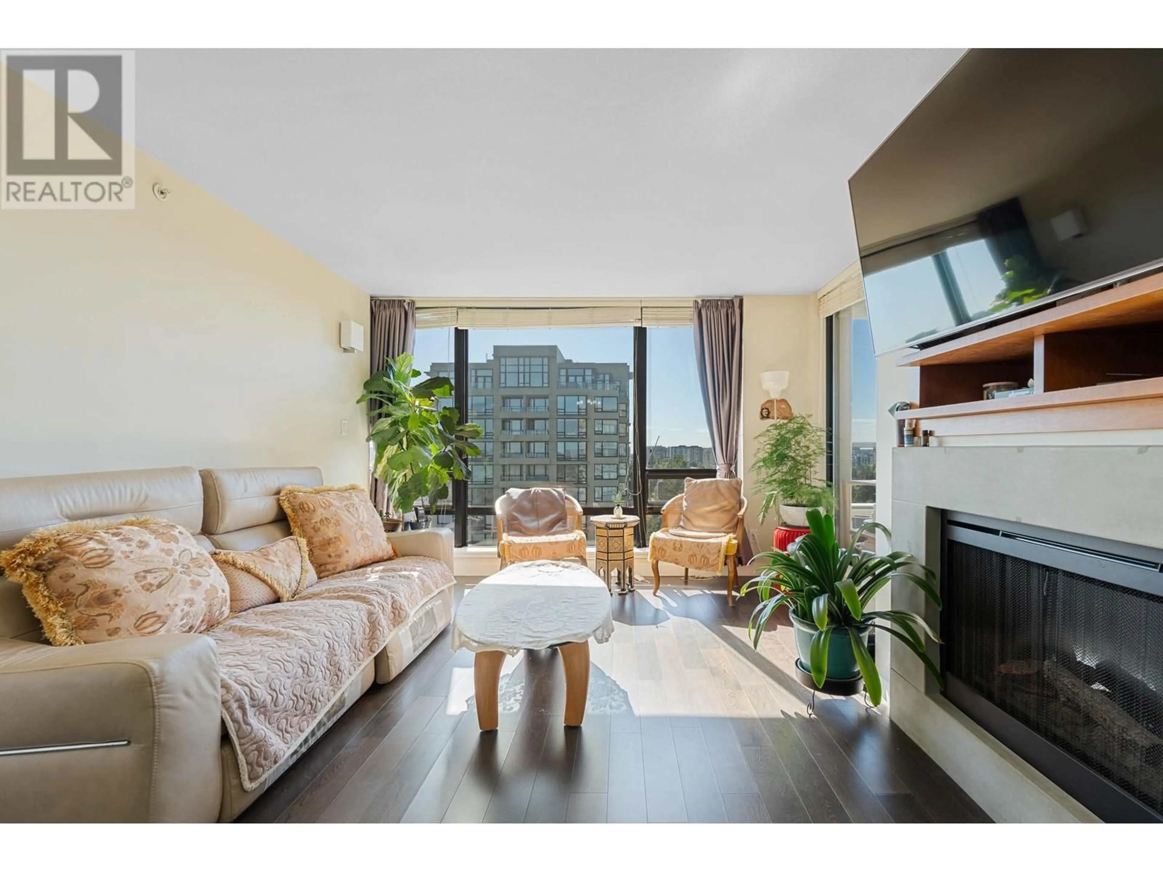 Living room with furniture, wood/laminate floor for 1501 - 9133 HEMLOCK DRIVE, Richmond British Columbia V6Y4J9