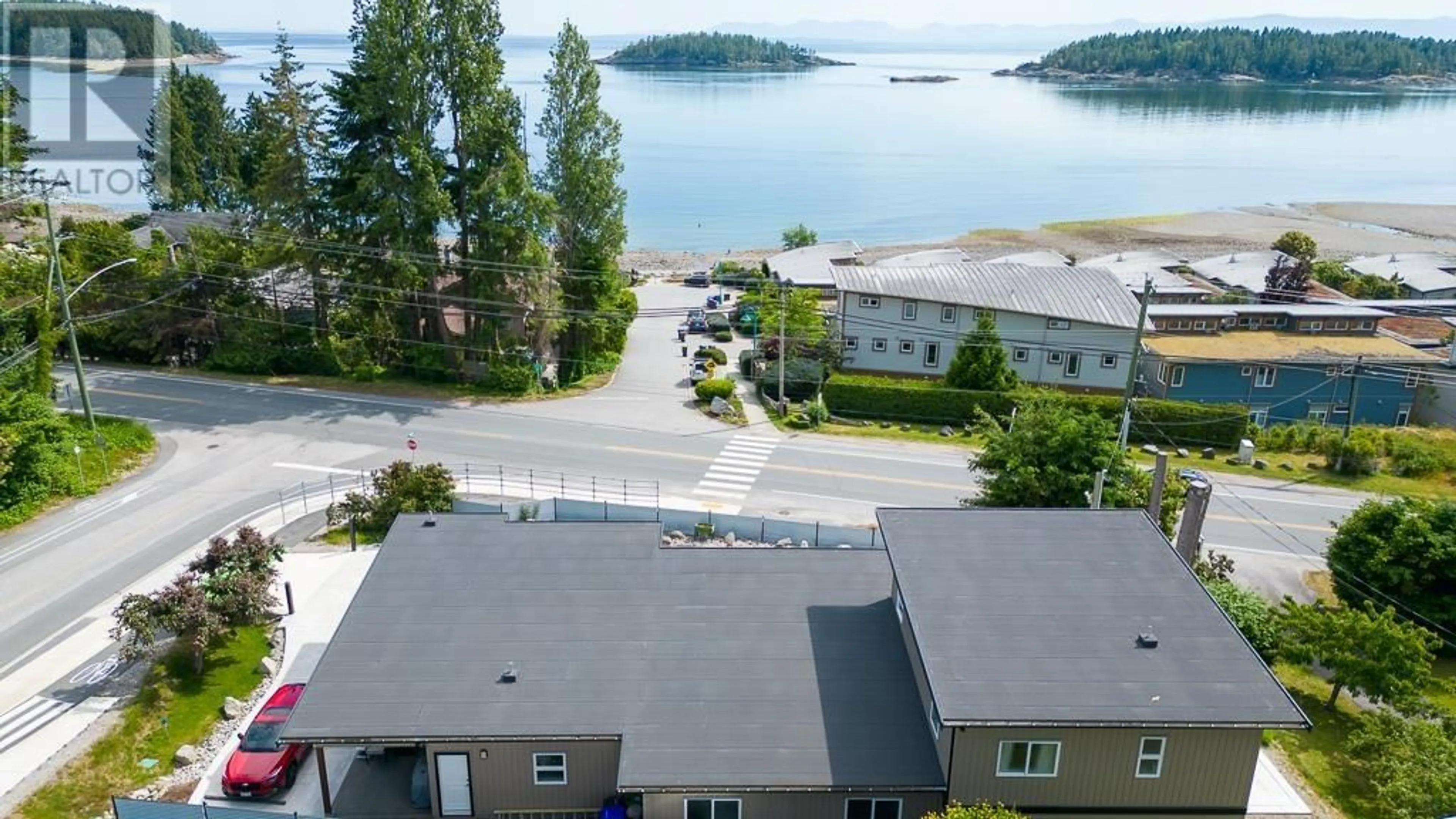A pic from outside/outdoor area/front of a property/back of a property/a pic from drone, water/lake/river/ocean view for 5425 MASON ROAD, Sechelt British Columbia V7Z0S8