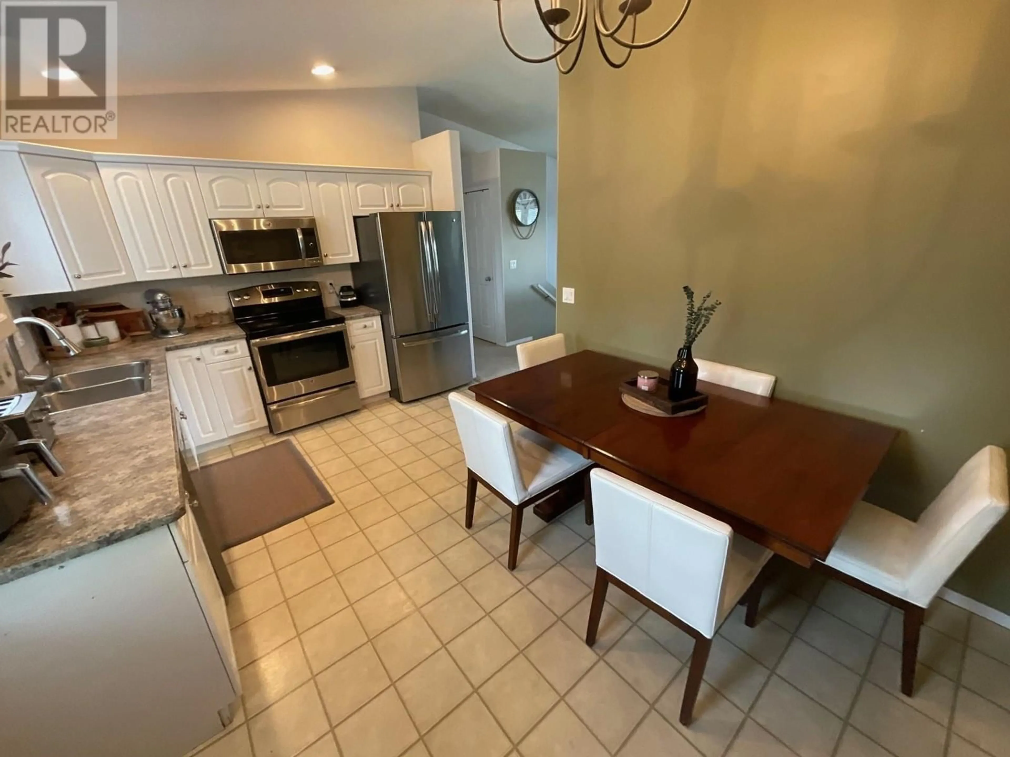 Open concept kitchen, ceramic/tile floor for 11411 96A STREET, Fort St. John British Columbia V1J7E5