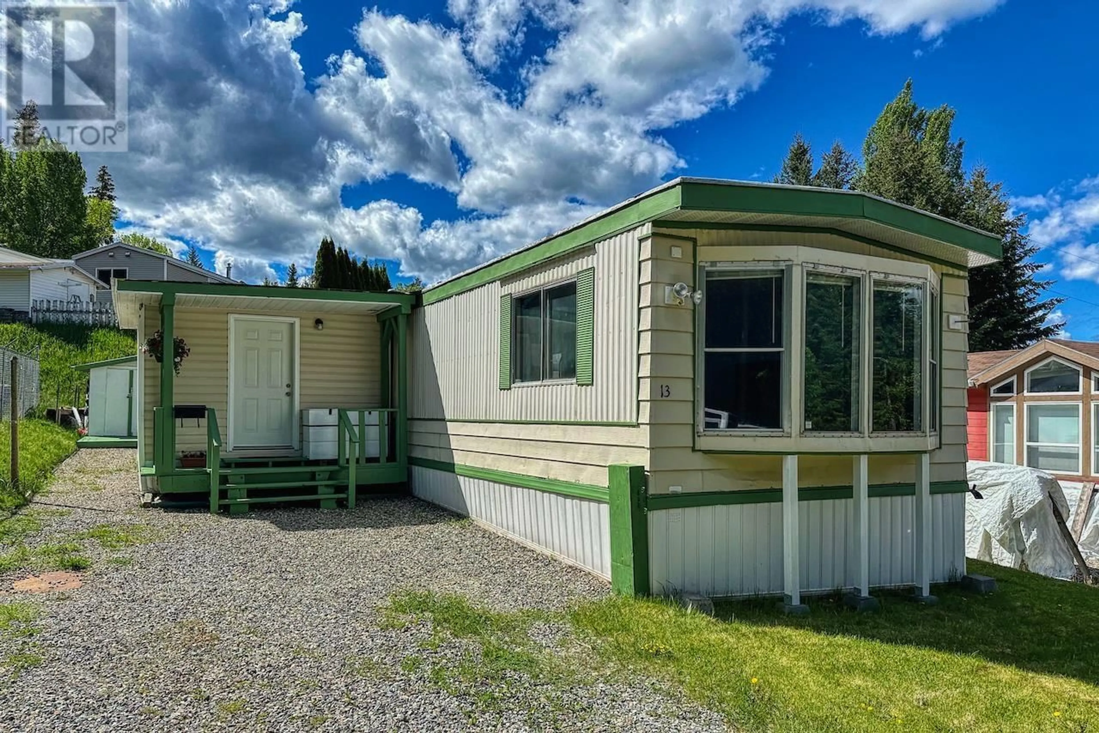 Home with vinyl exterior material, street for 13 - 997 CHILCOTIN 20 HIGHWAY, Williams Lake British Columbia V2G4X6