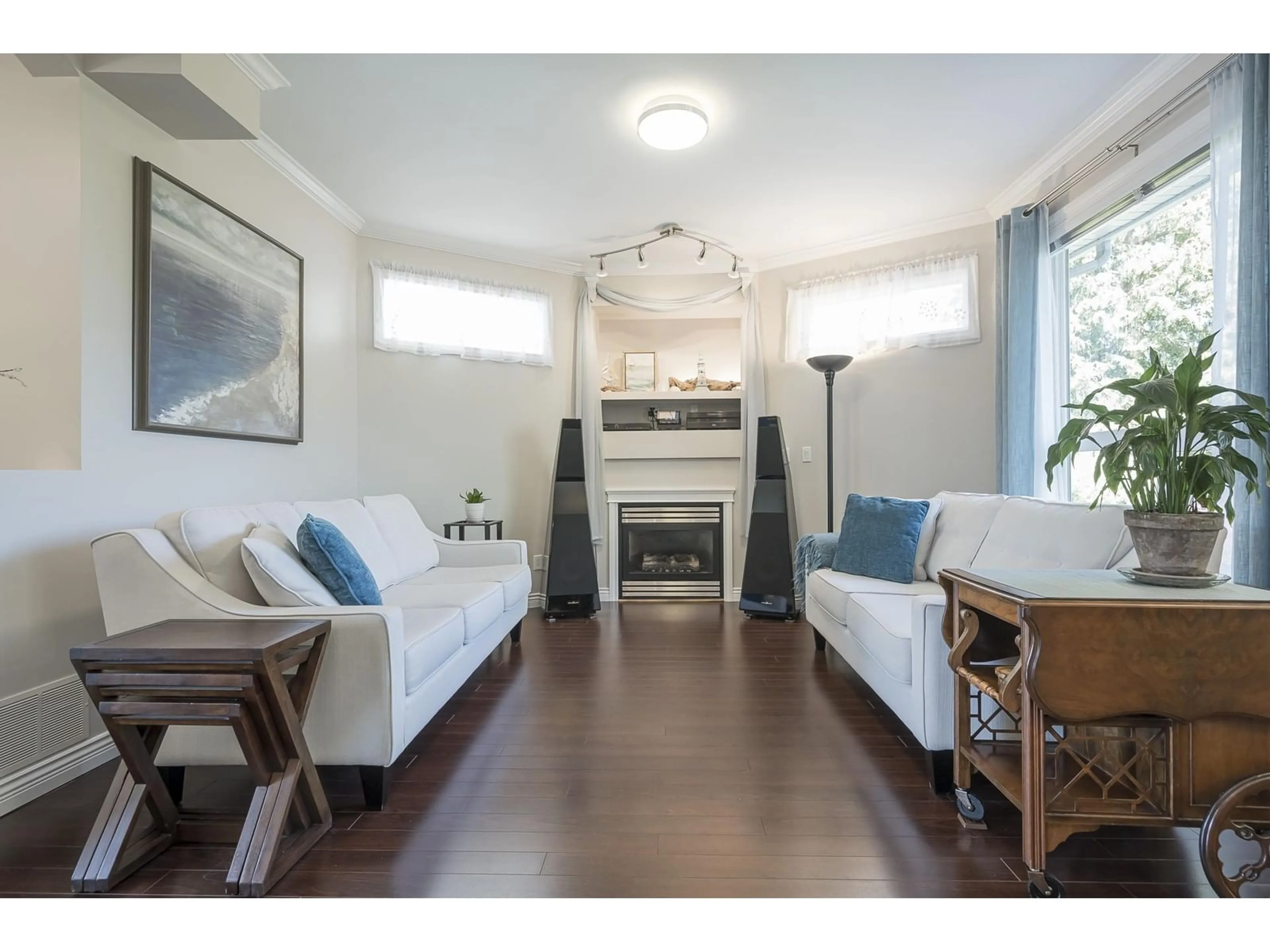 Living room with furniture, wood/laminate floor for 16477 59A, Surrey British Columbia V3S6M6