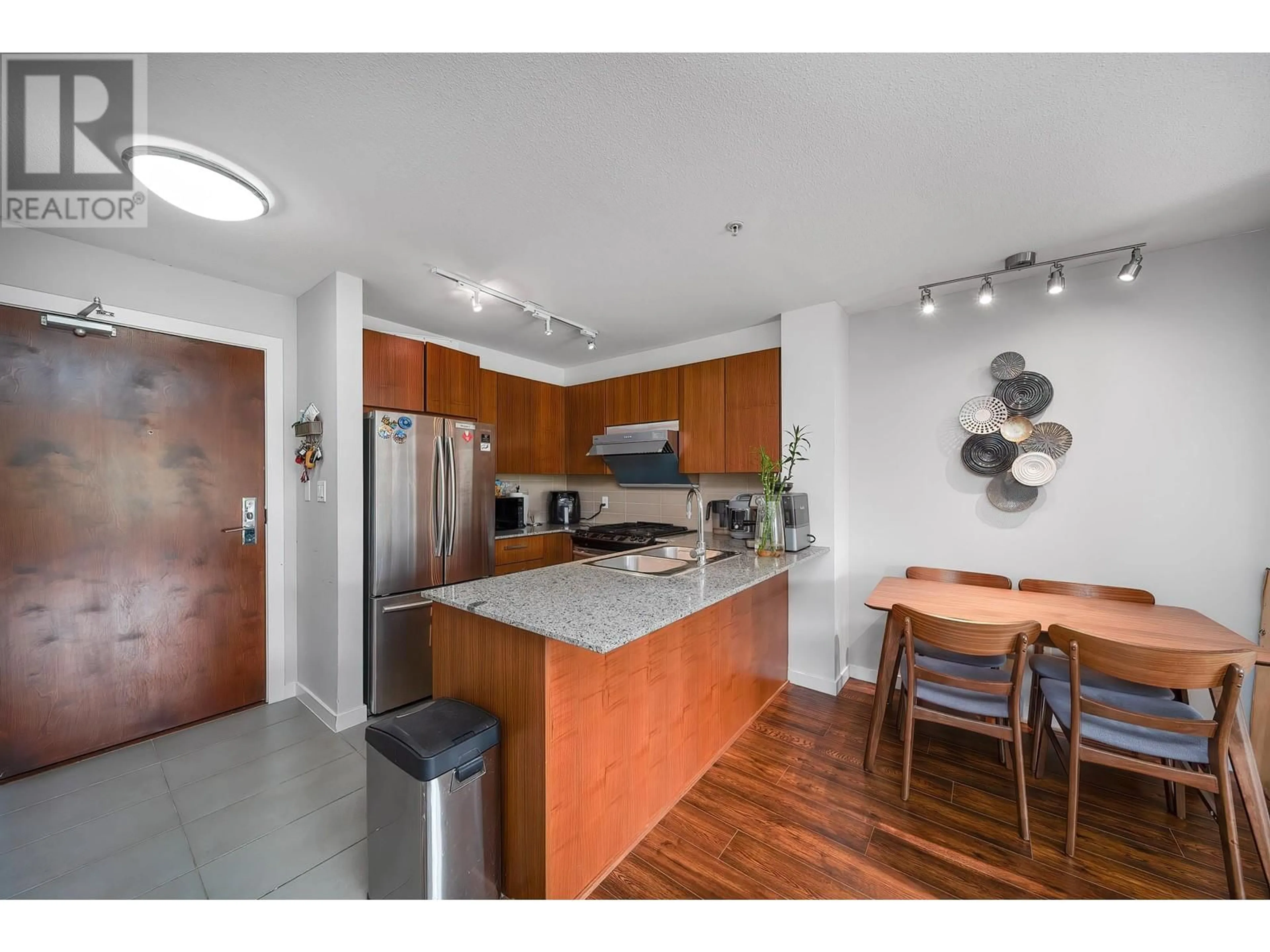 Open concept kitchen, wood/laminate floor for 214 - 5885 IRMIN STREET, Burnaby British Columbia V5J0C2