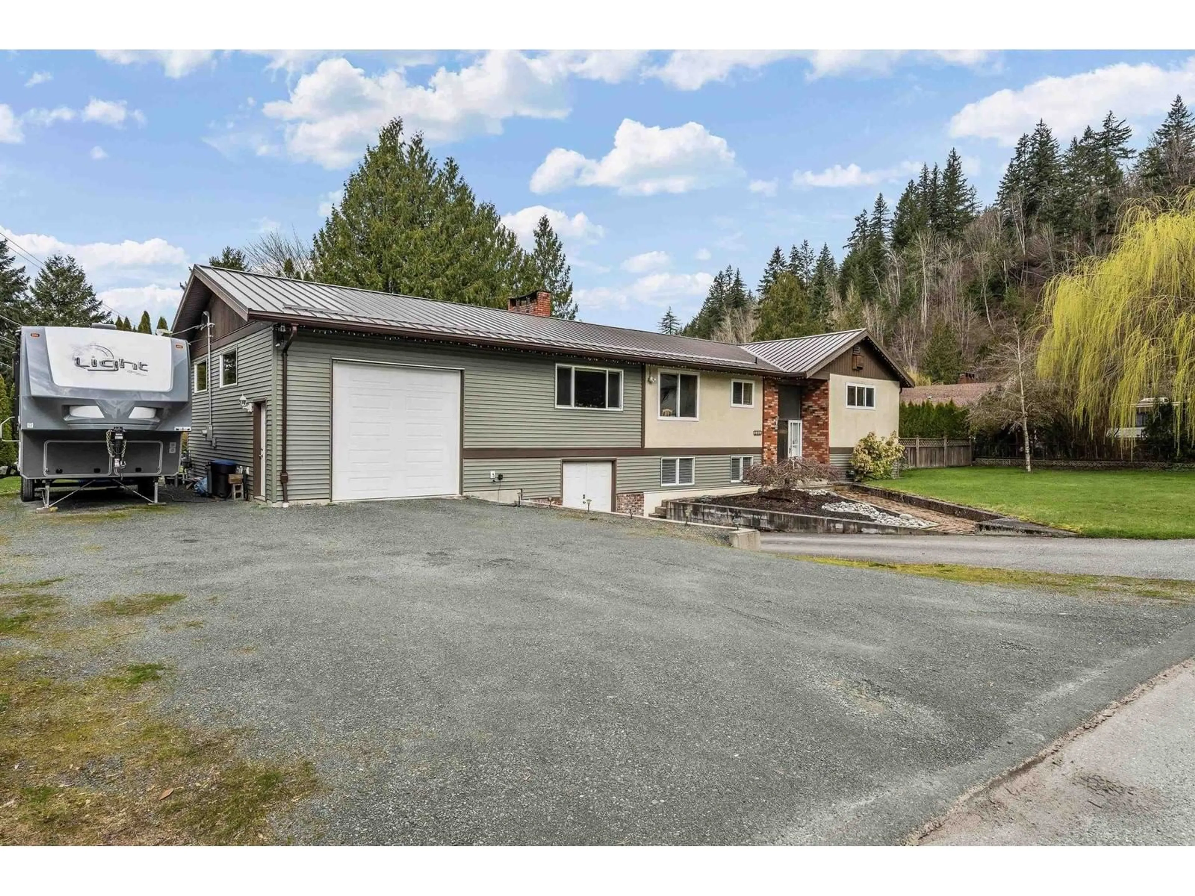 A pic from outside/outdoor area/front of a property/back of a property/a pic from drone, street for 4563 LYARDON ROAD, Chilliwack British Columbia V2R4N1