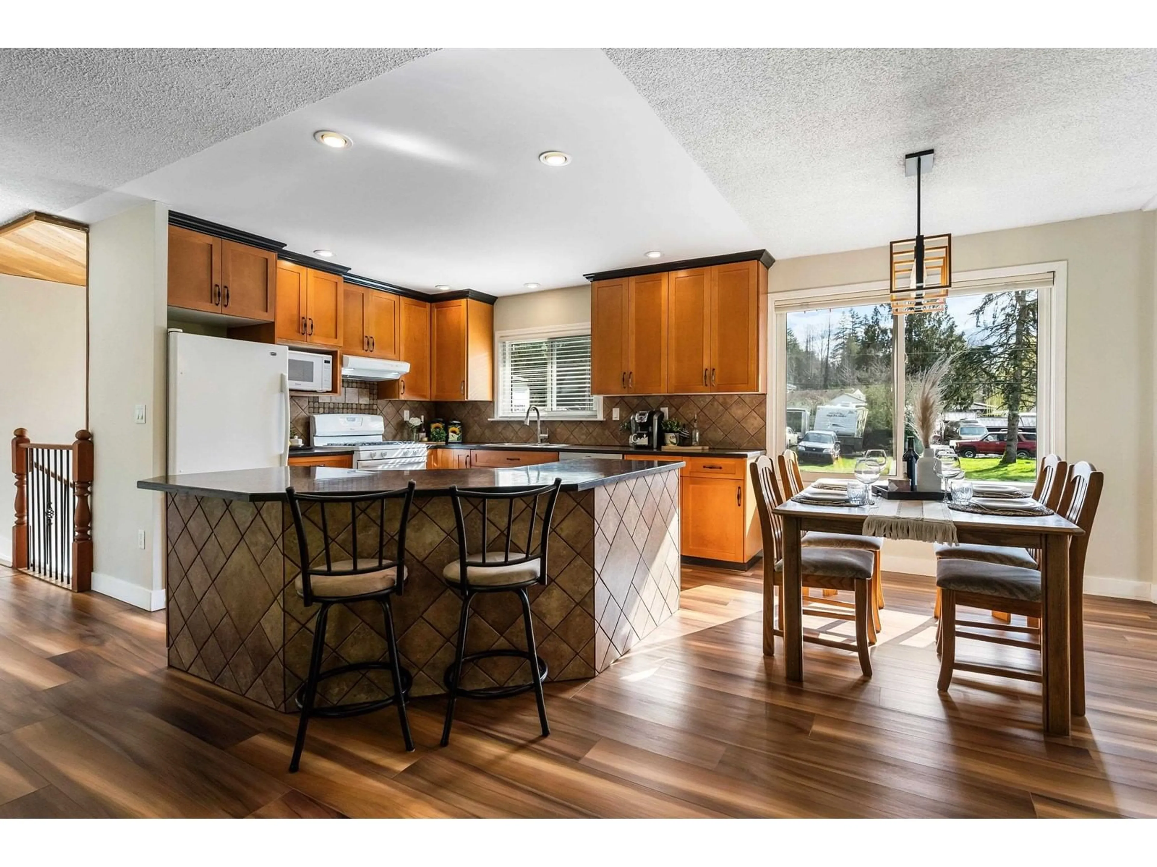 Open concept kitchen, wood/laminate floor for 4563 LYARDON ROAD, Chilliwack British Columbia V2R4N1