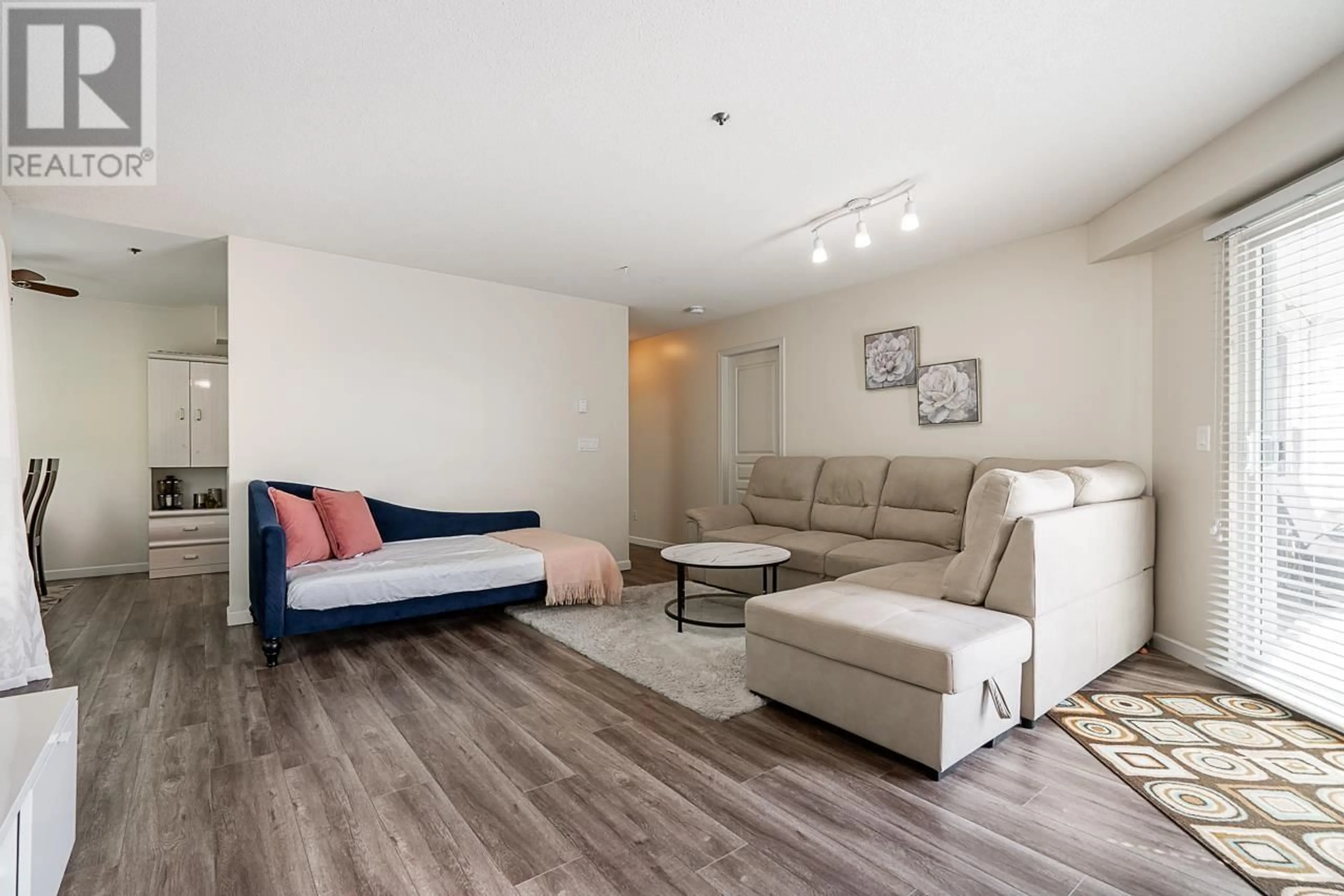 Living room with furniture, wood/laminate floor for 64 - 2727 KENT AVENUE NORTH, Vancouver British Columbia V5S3T9