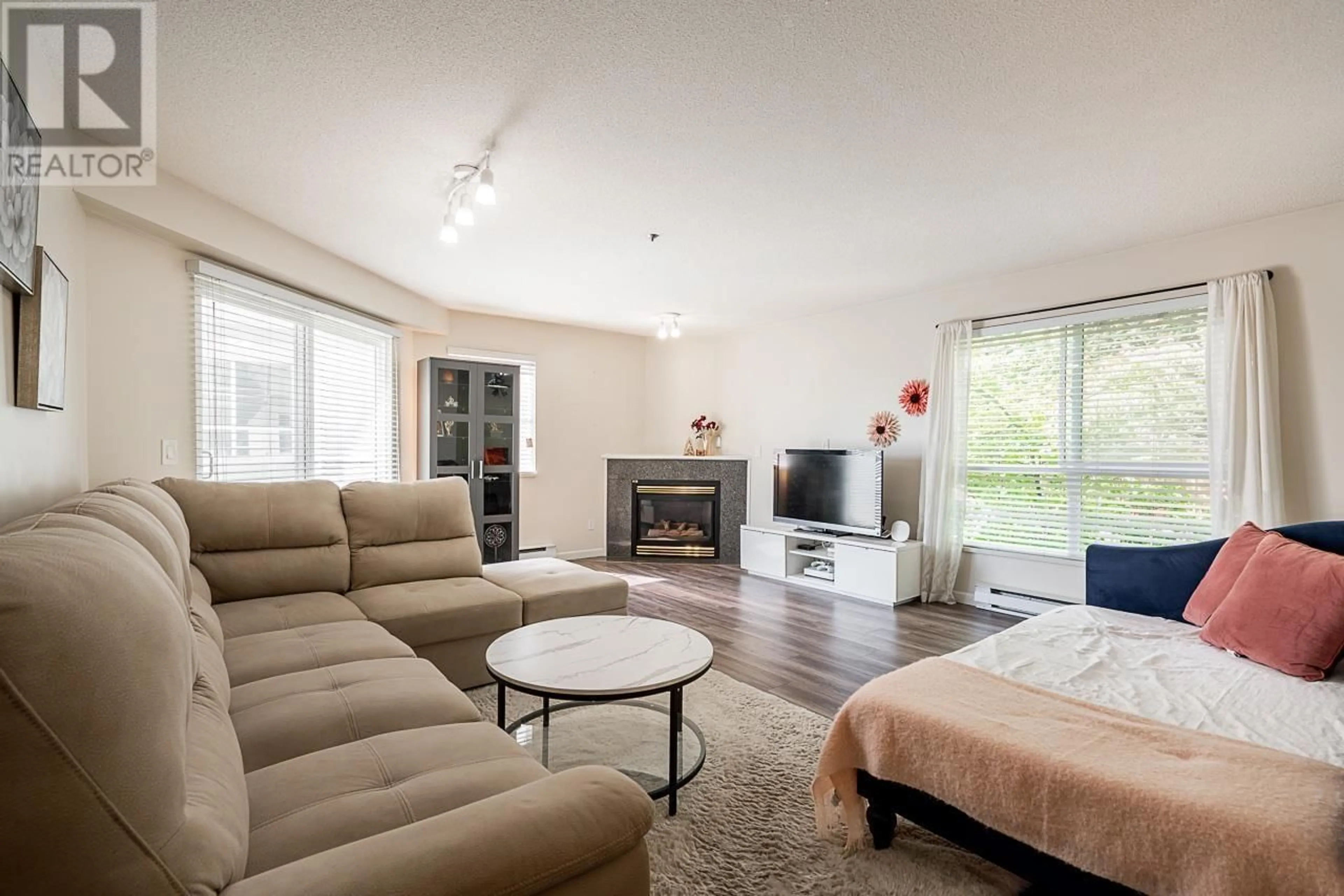 Living room with furniture, wood/laminate floor for 64 - 2727 KENT AVENUE NORTH, Vancouver British Columbia V5S3T9