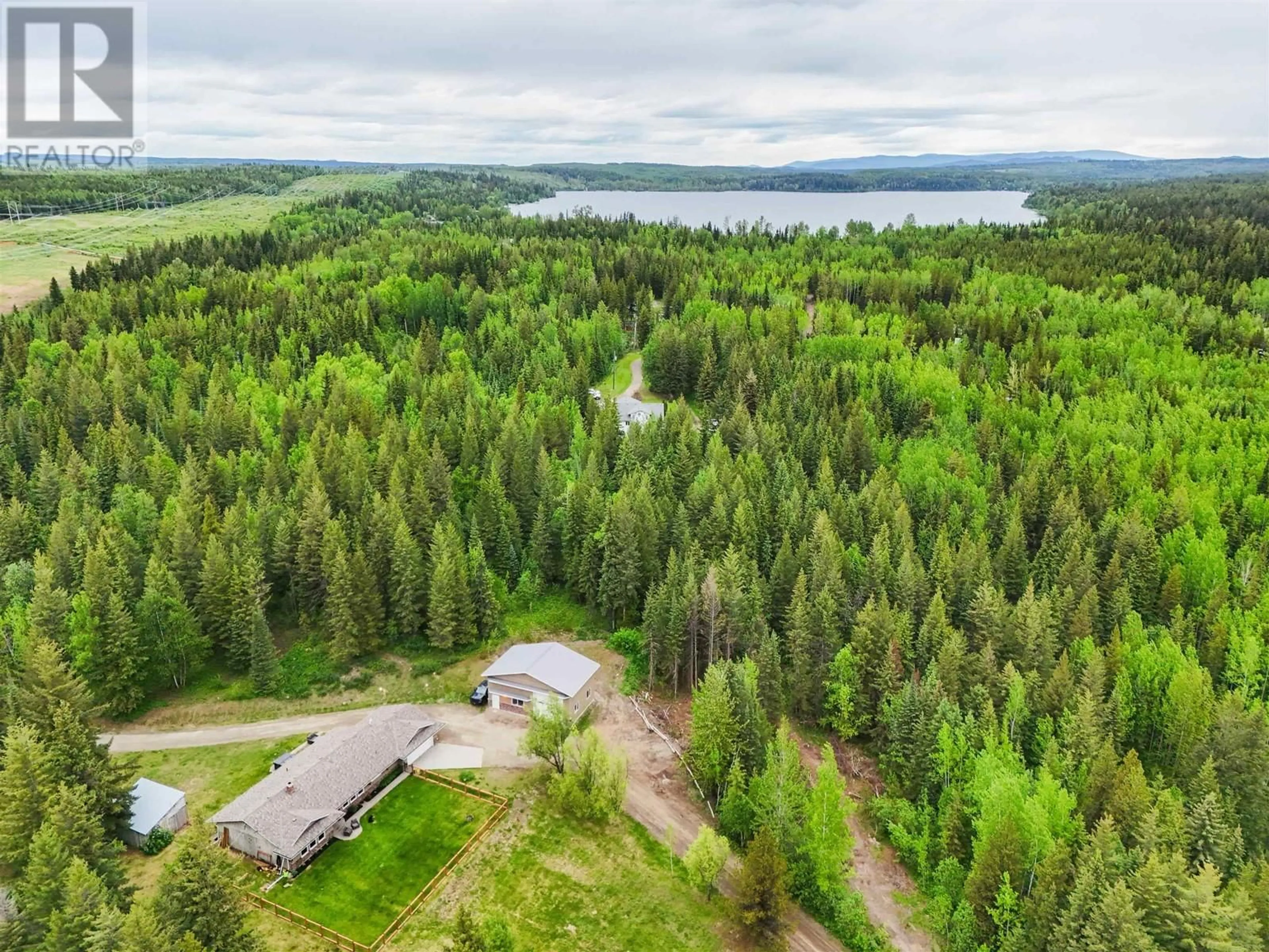 A pic from outside/outdoor area/front of a property/back of a property/a pic from drone, water/lake/river/ocean view for 4678 TEN MILE LAKE ROAD, Quesnel British Columbia V2J6X2