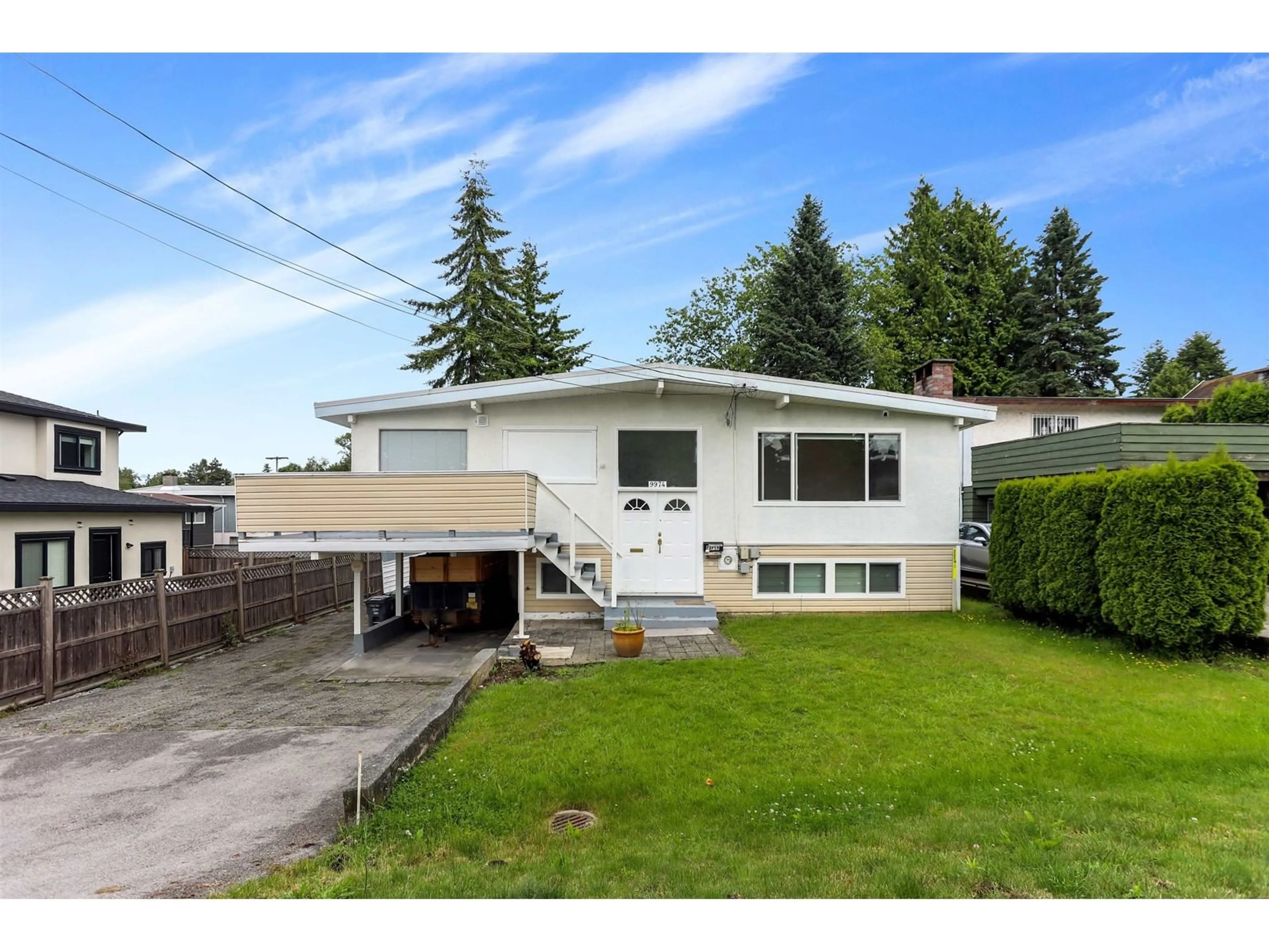 Home with vinyl exterior material, street for 9974 123A, Surrey British Columbia V3V4R2