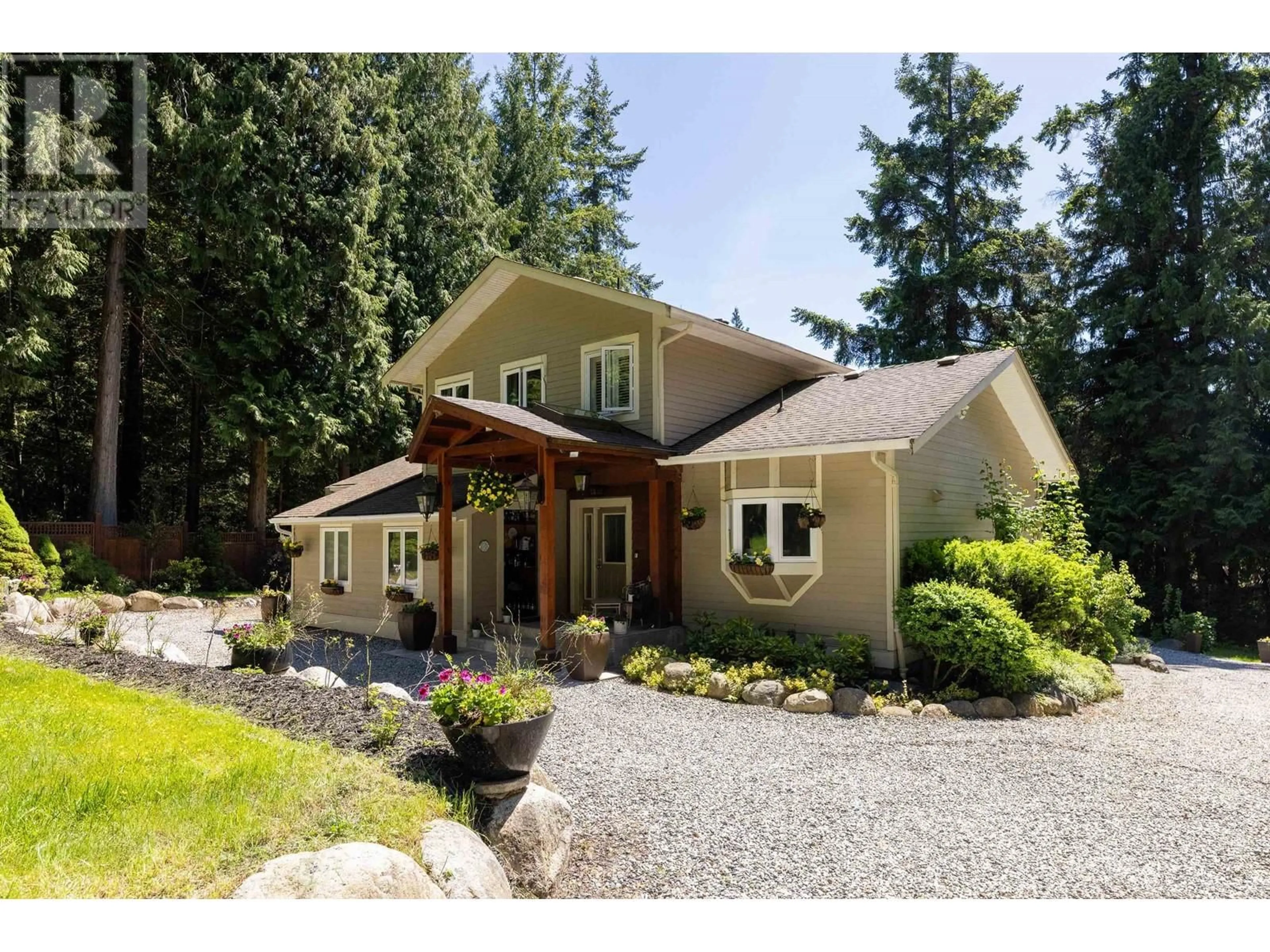 Home with vinyl exterior material, street for 2596 MILES ROAD, Roberts Creek British Columbia V0N2W4
