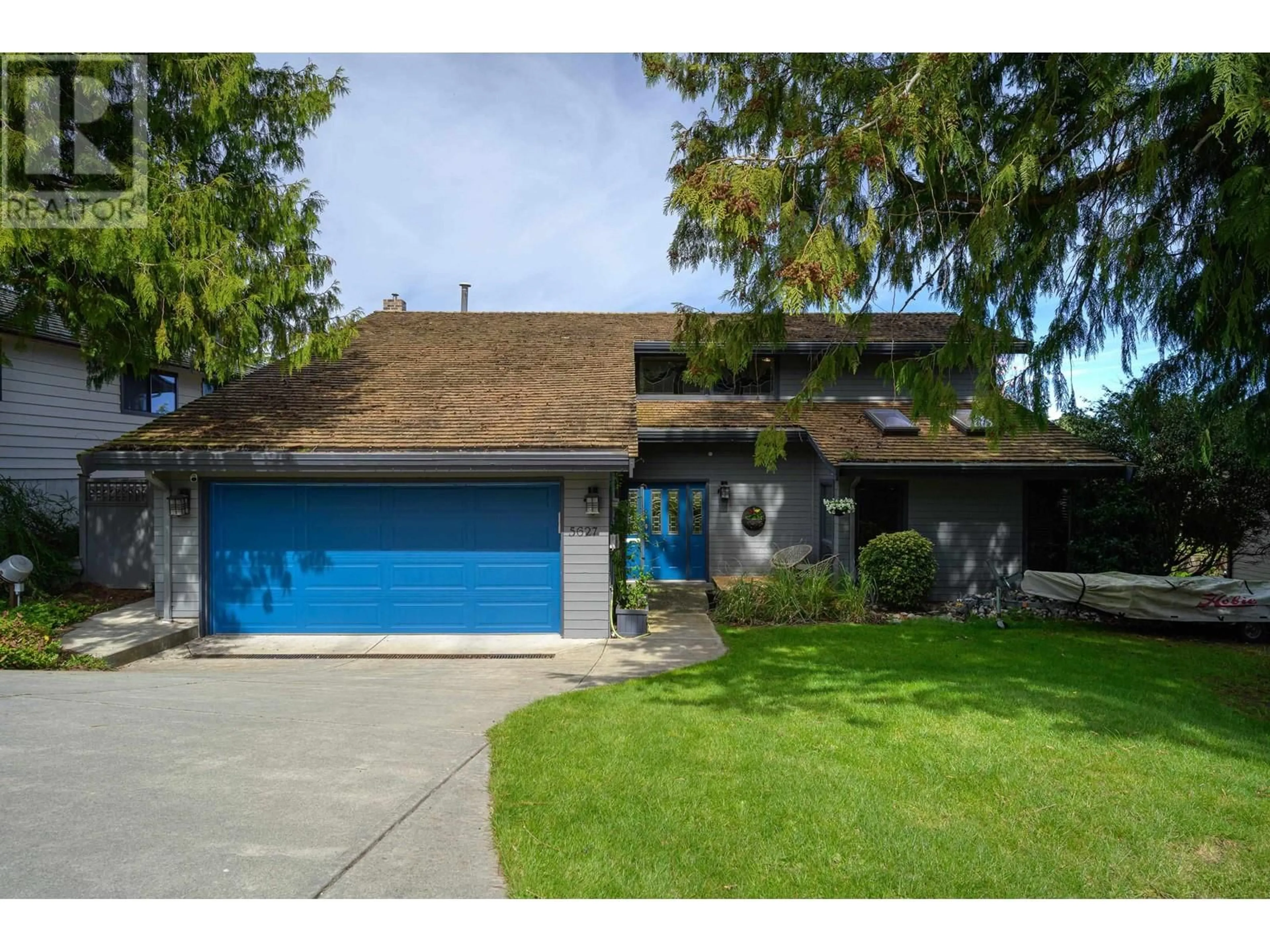 Home with vinyl exterior material, street for 5627 TIMBERVALLEY ROAD, Delta British Columbia V4L2E7