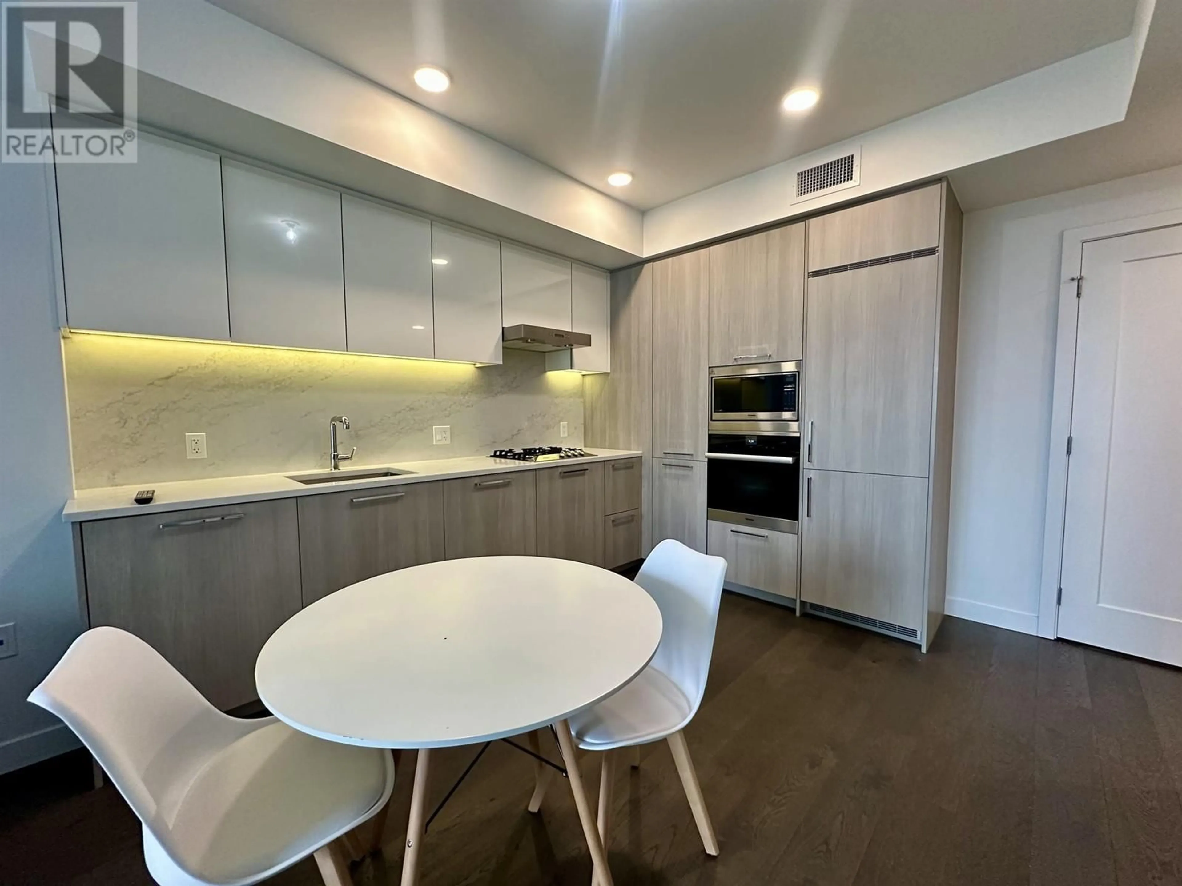 Open concept kitchen, wood/laminate floor for 812 - 3200 CORVETTE WAY, Richmond British Columbia V6X0T8