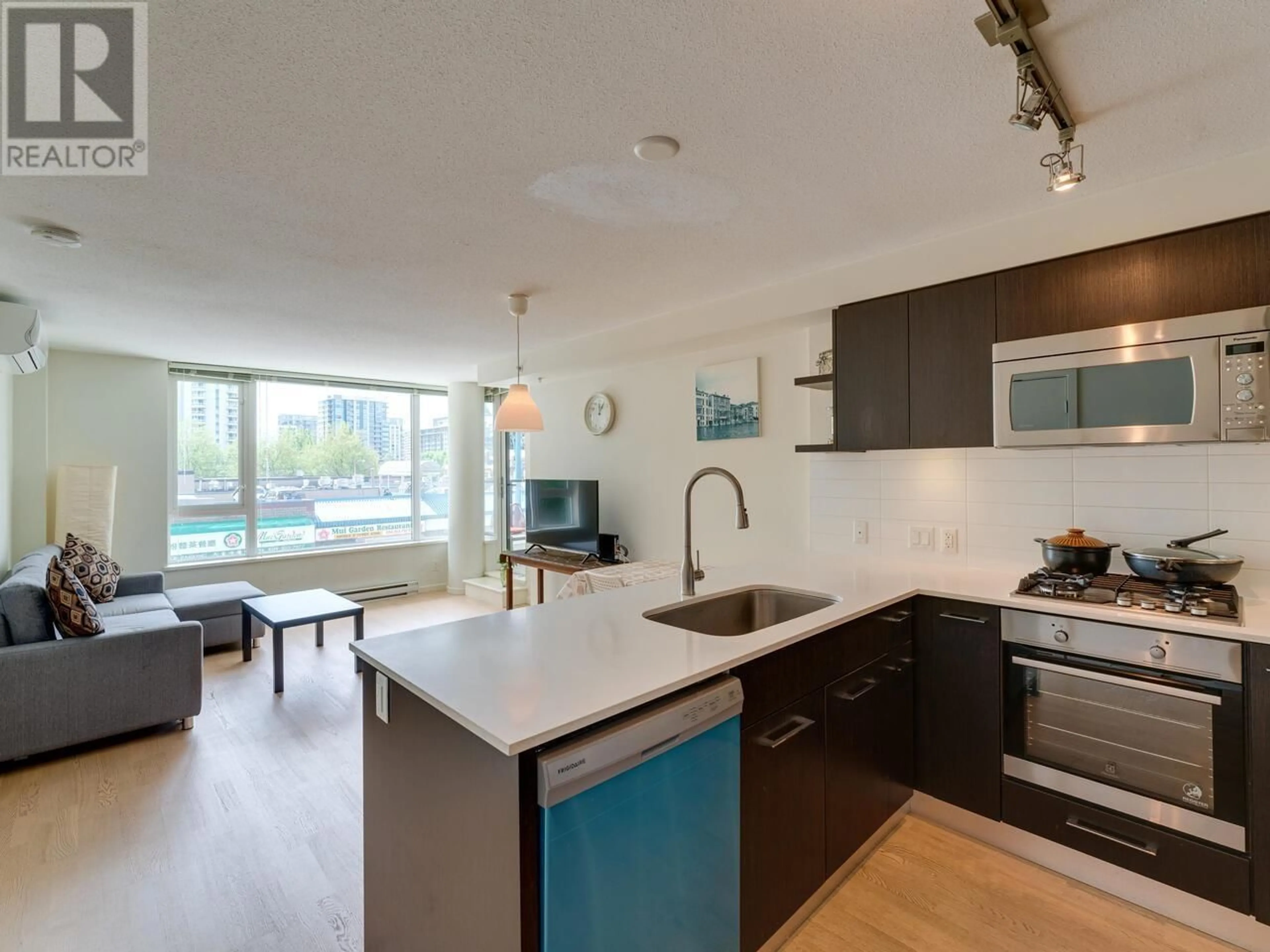 Open concept kitchen, unknown for 301 - 7733 FIRBRIDGE WAY, Richmond British Columbia V6X0M7