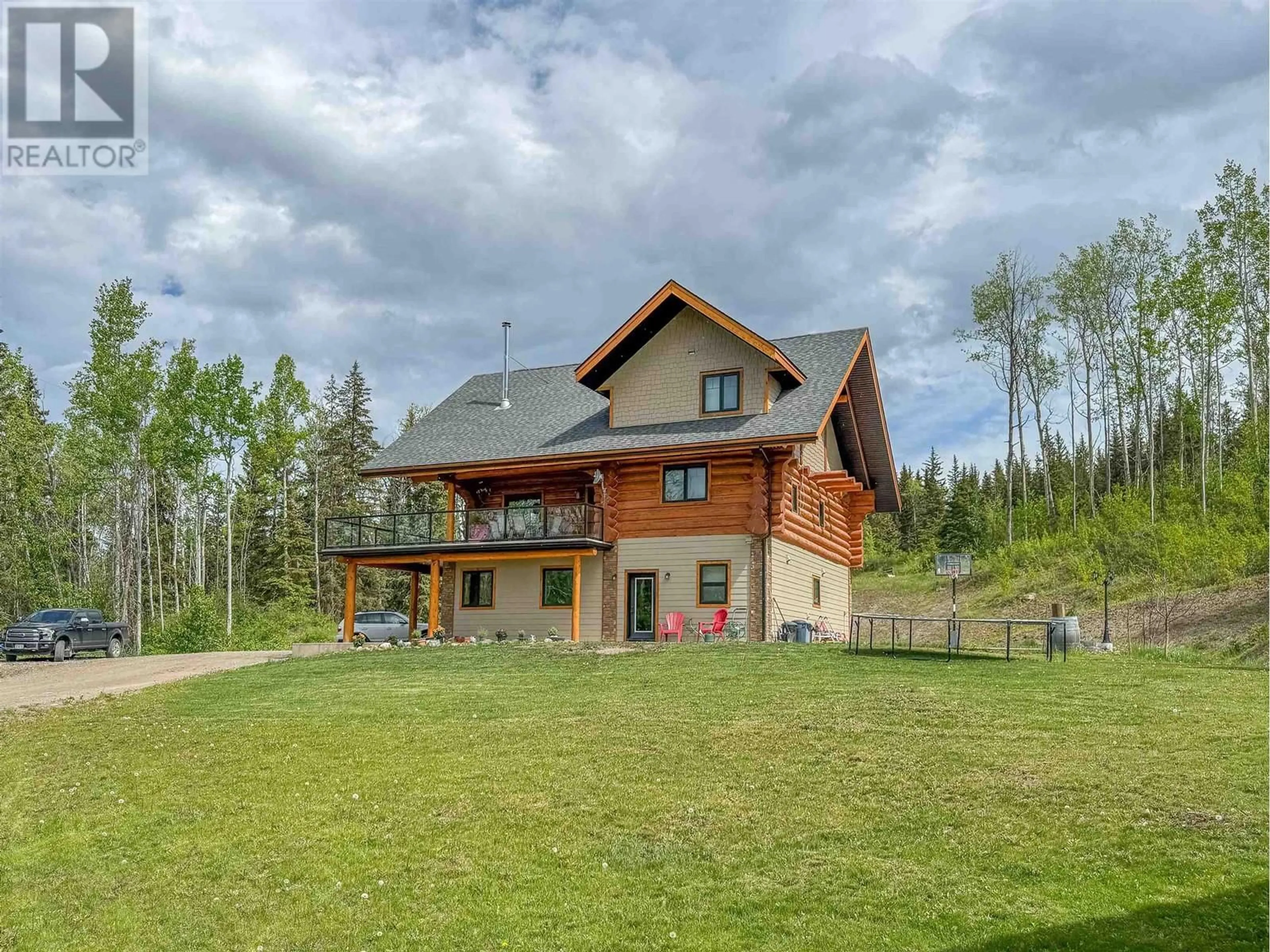 A pic from outside/outdoor area/front of a property/back of a property/a pic from drone, mountain view for 585 16 HIGHWAY, Smithers British Columbia V0J2N6