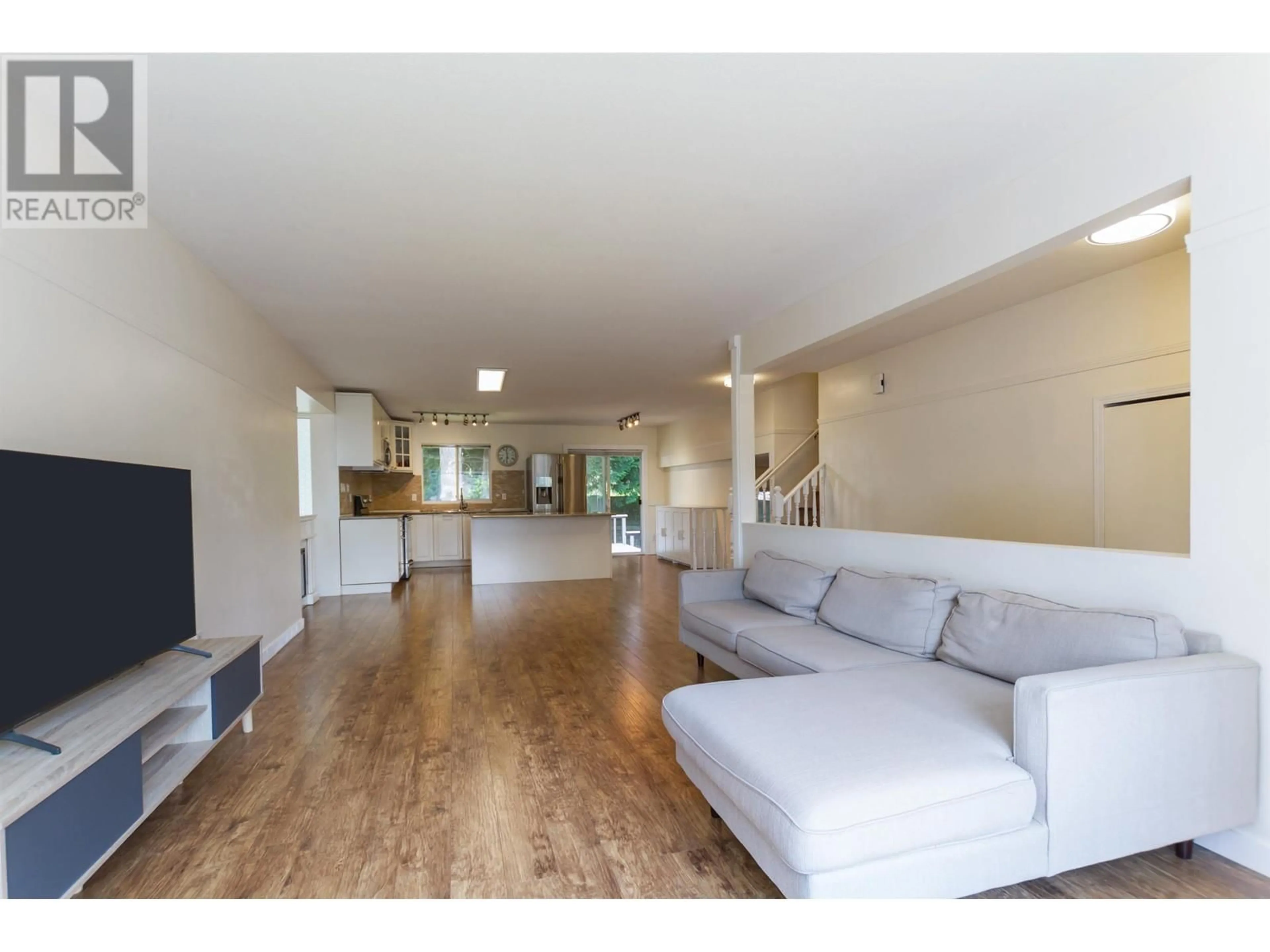 Living room with furniture, wood/laminate floor for 19439 DAVISON ROAD, Pitt Meadows British Columbia V3Y1A7