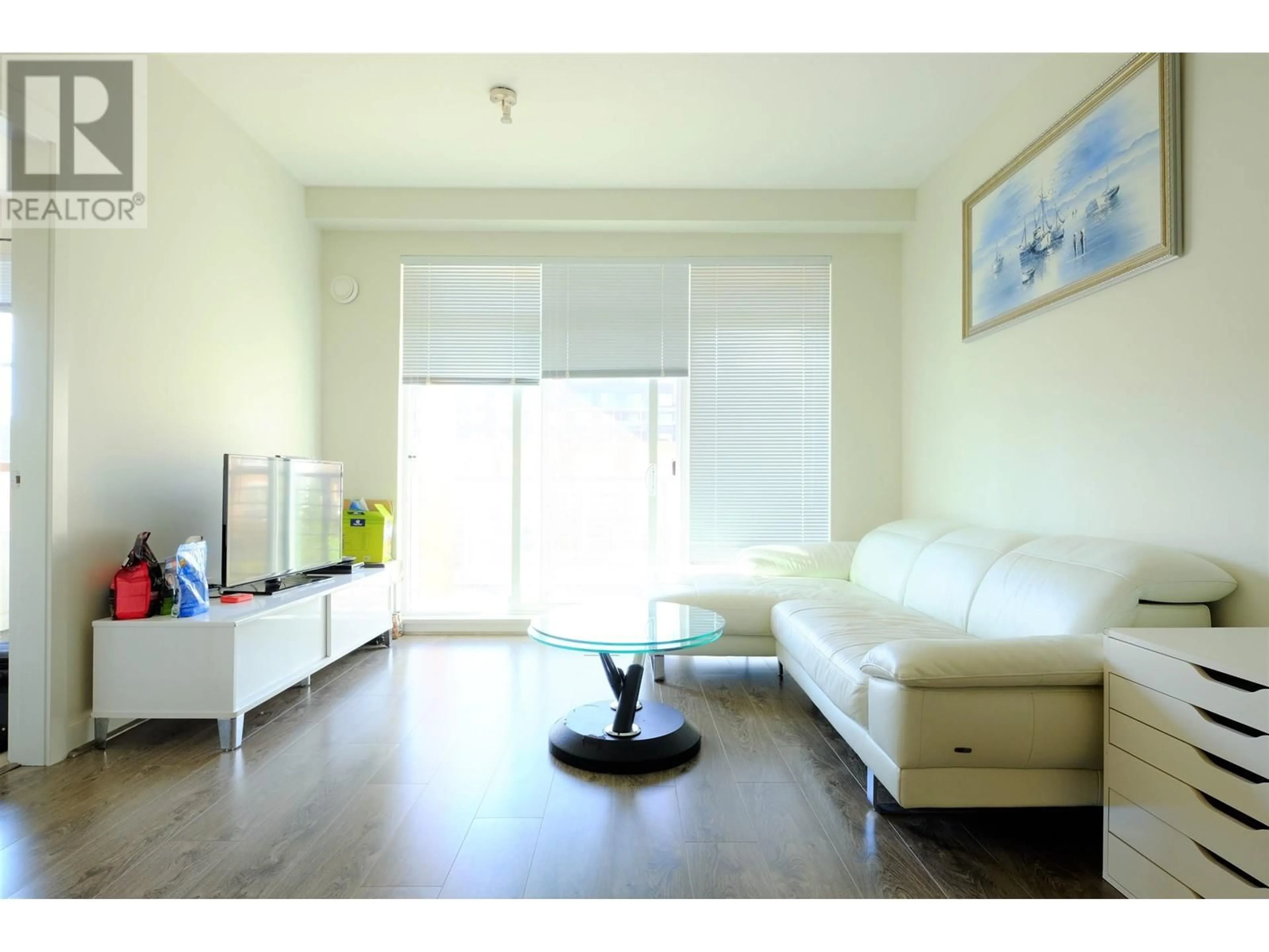 Living room with furniture, wood/laminate floor for 309 - 5981 GRAY AVENUE, Vancouver British Columbia V6S0G1